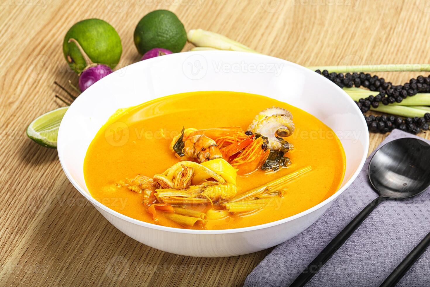 Thai Tom Yum soup with seafood photo