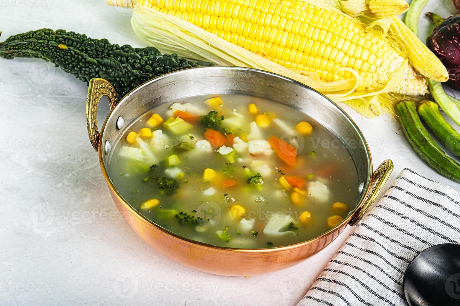 Soup with corn and broccoli photo