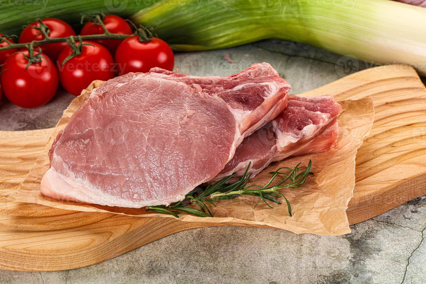 Raw pork steak loin with bone photo