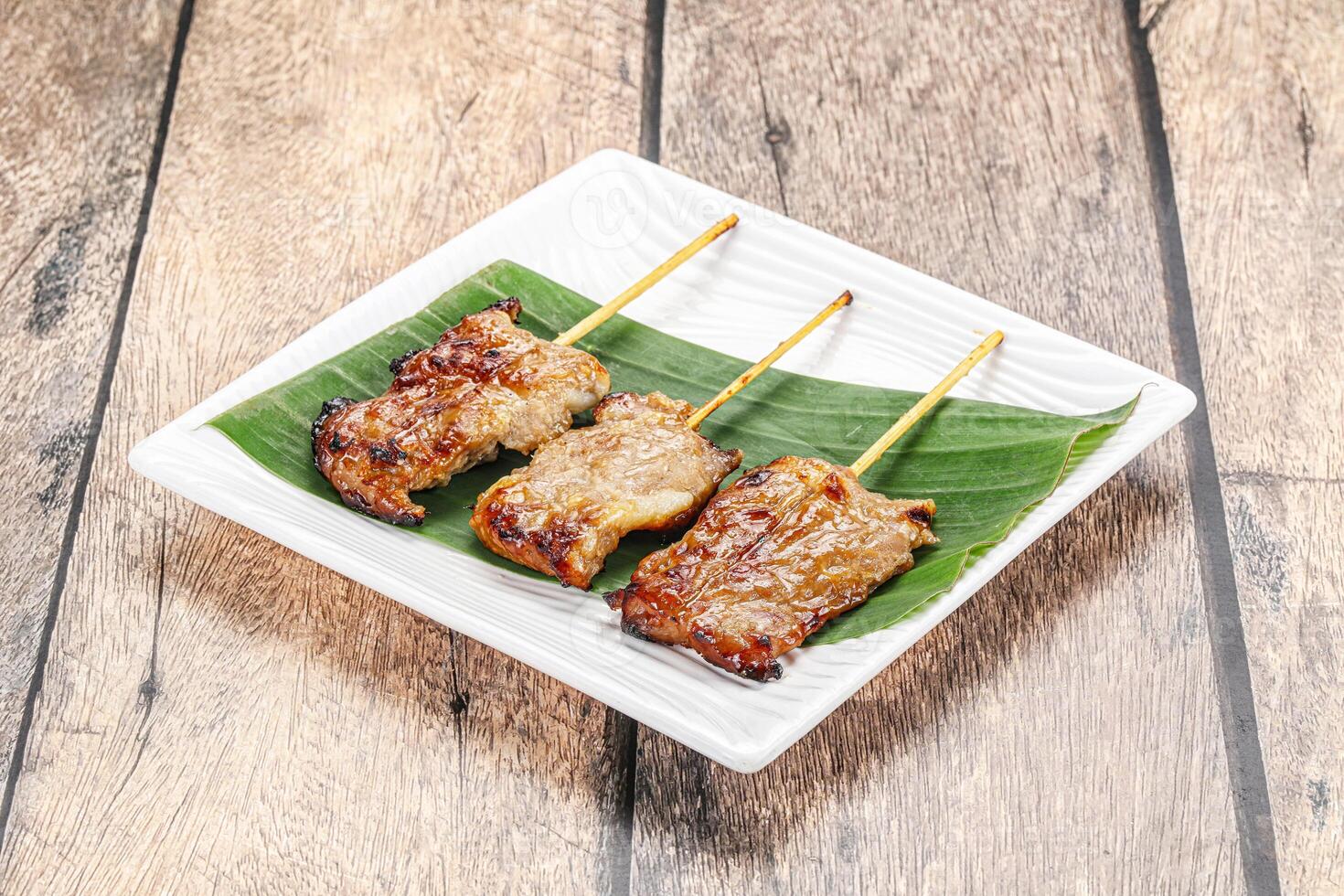 Thai cuisine - grilled pork skewer photo