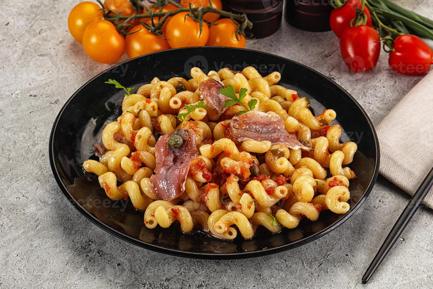 Italian pasta cellentani with anchovy photo