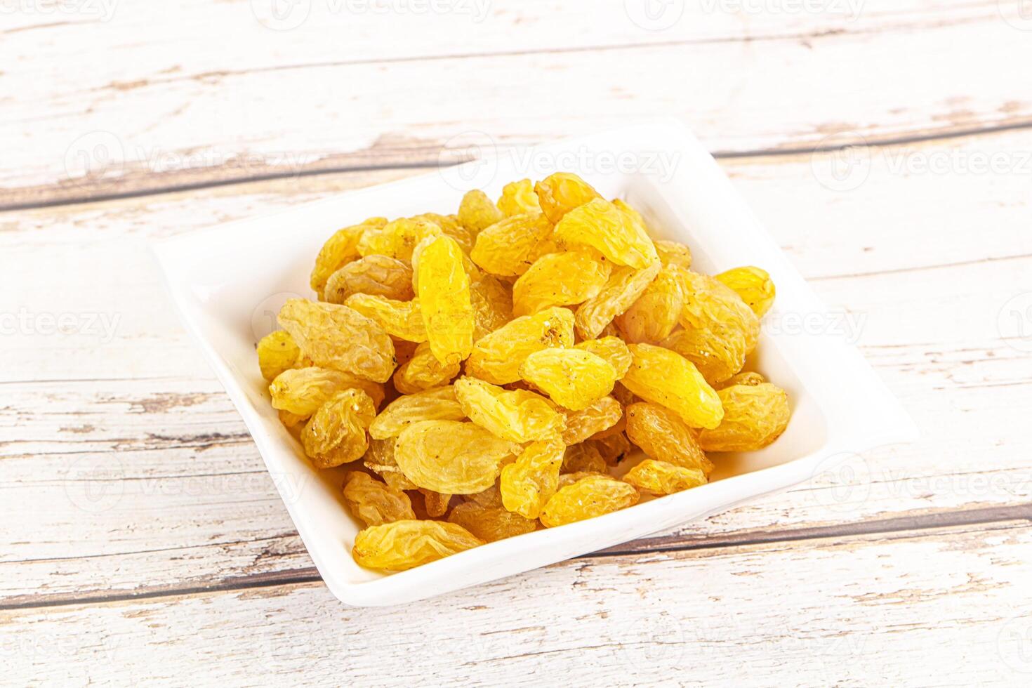 Yellow raisin - dry grape berries photo