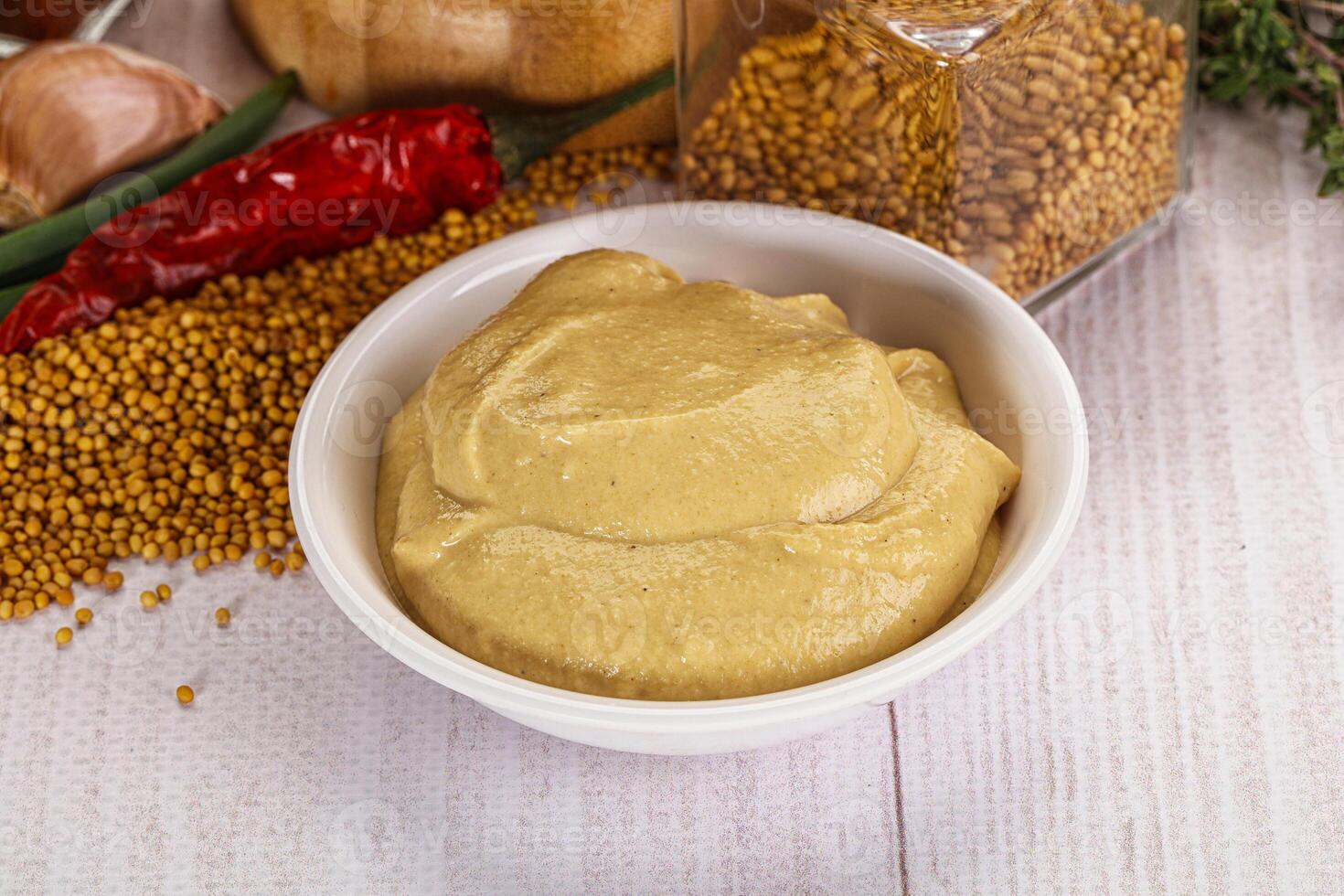 Dijon mustard sauce in the bowl photo