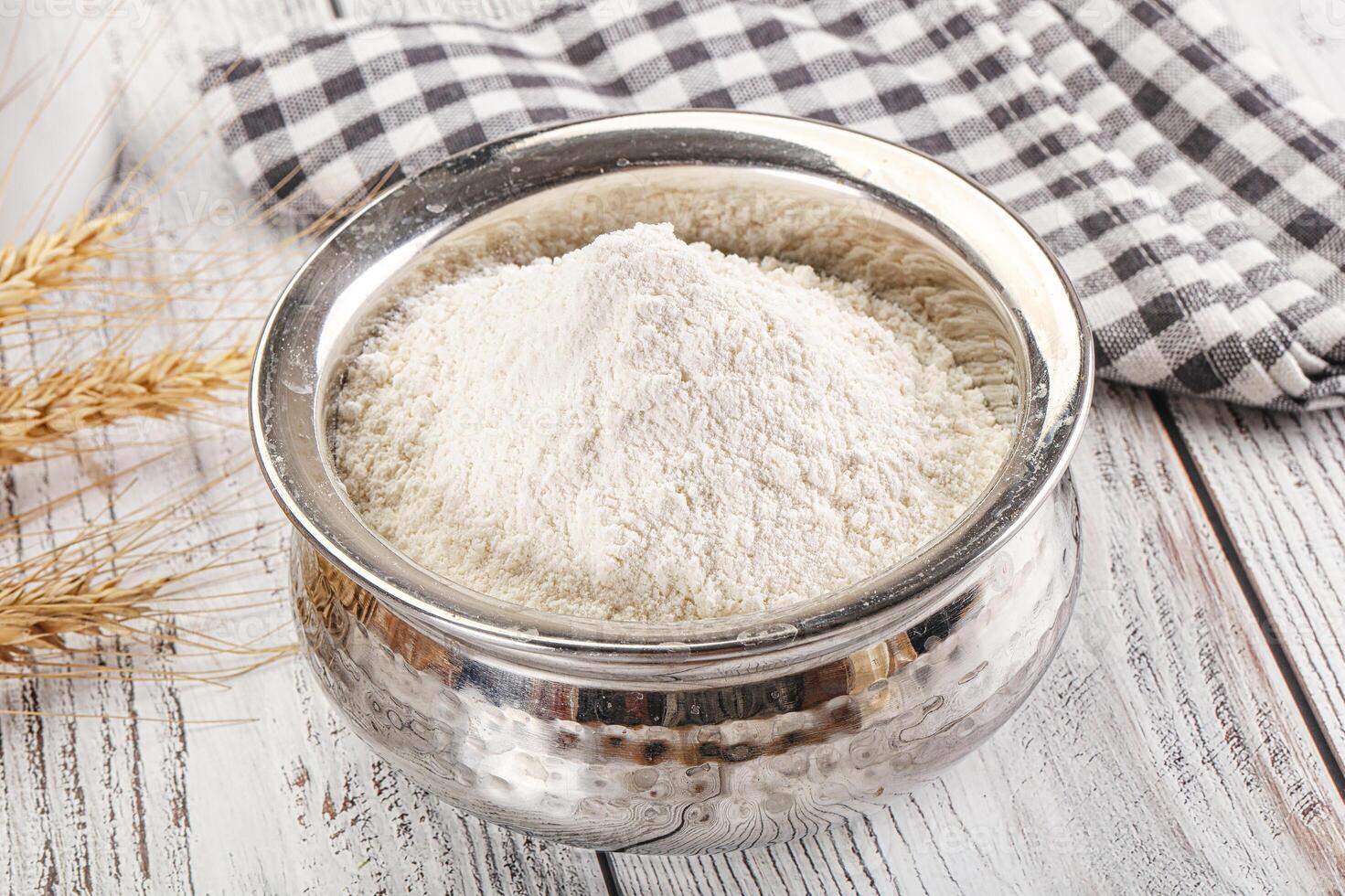 Wheat flour heap for bake photo