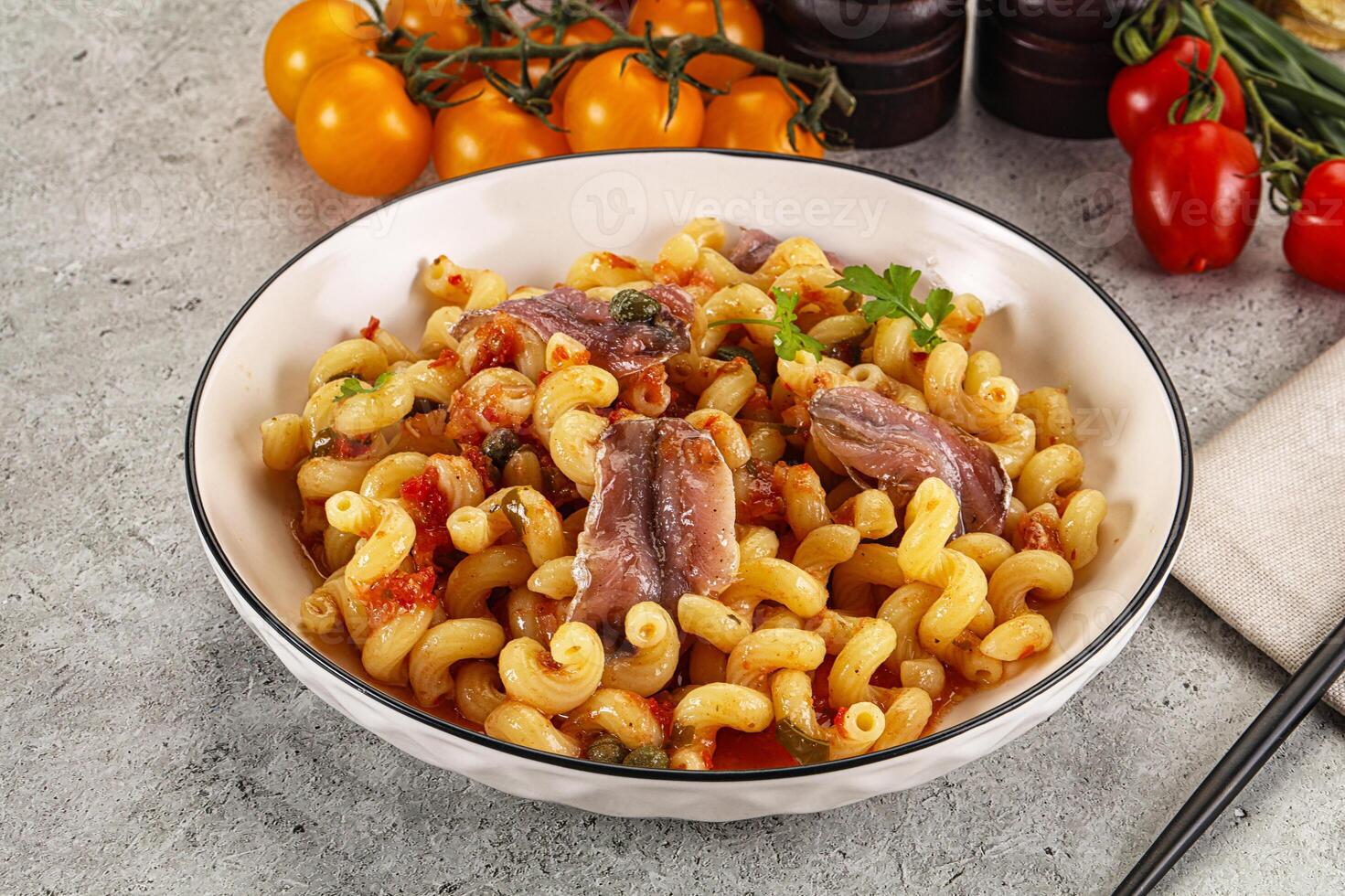 Italian pasta cellentani with anchovy photo