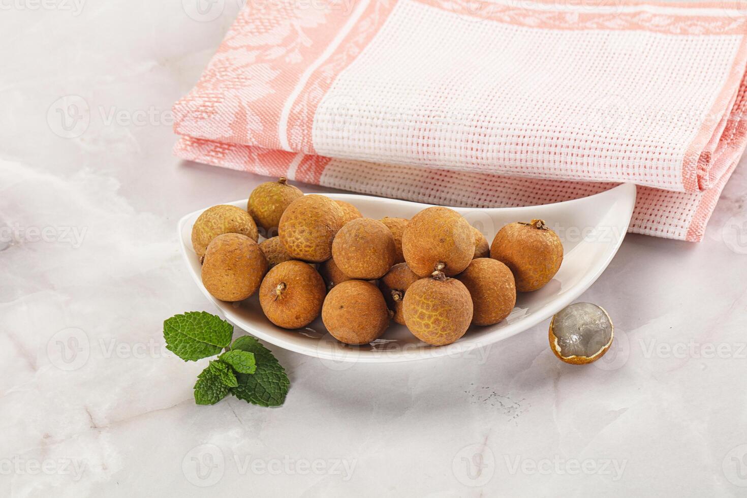 Tropical delicous fruit Longan heap photo