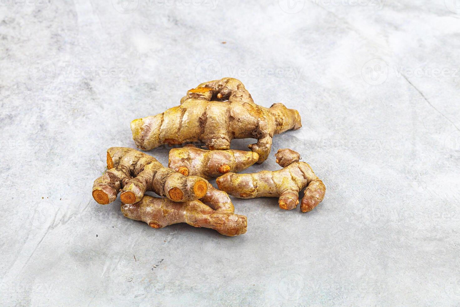 Fresh young Tumeric root heap photo