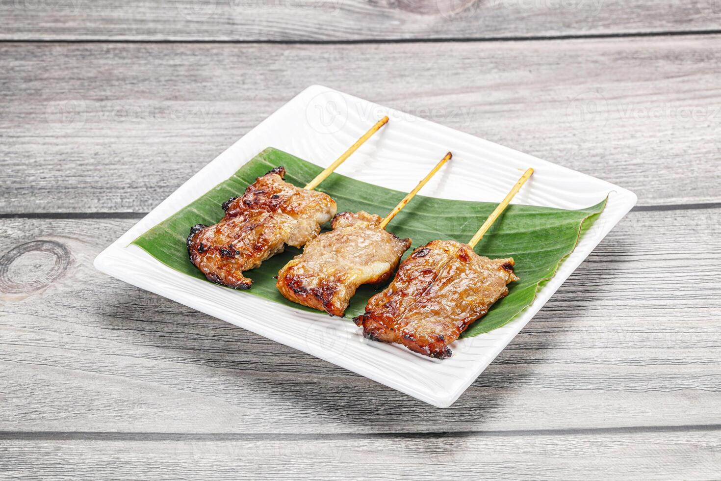 Thai cuisine - grilled pork skewer photo