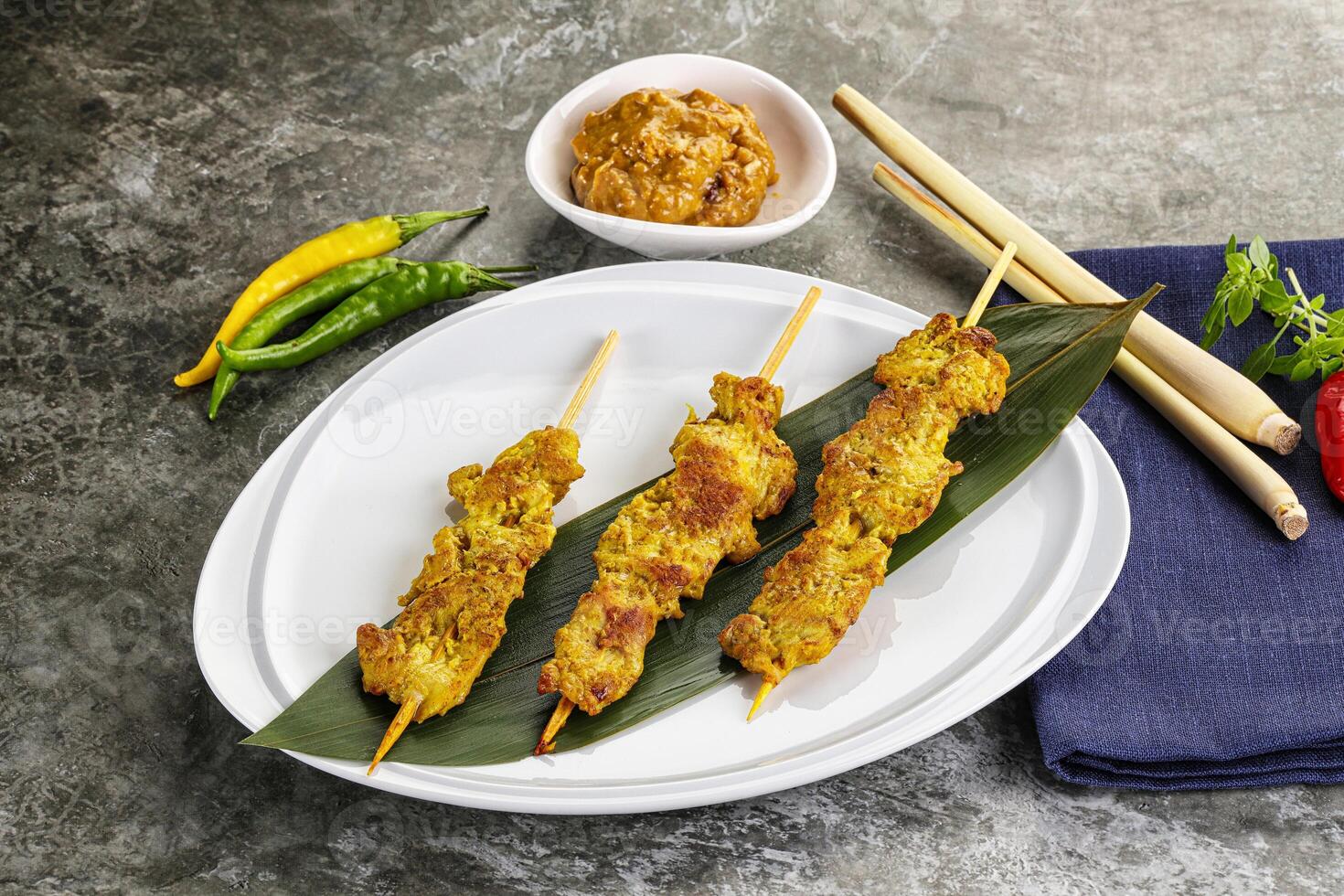 Thai meat skewer Satay with sauce photo