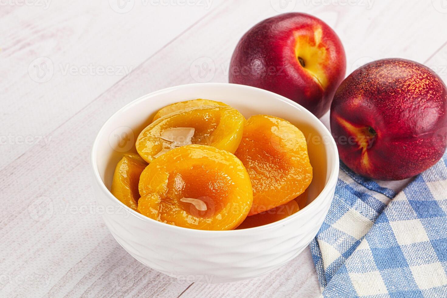 Canned peaches with sweet syrope photo
