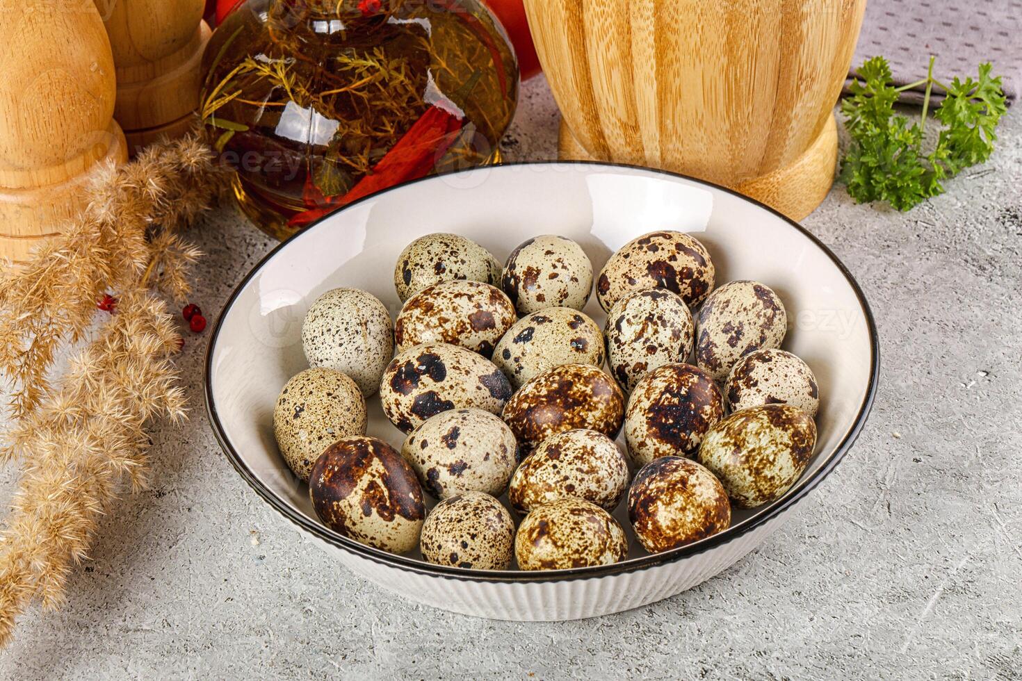 Raw quail egg in the bowl photo
