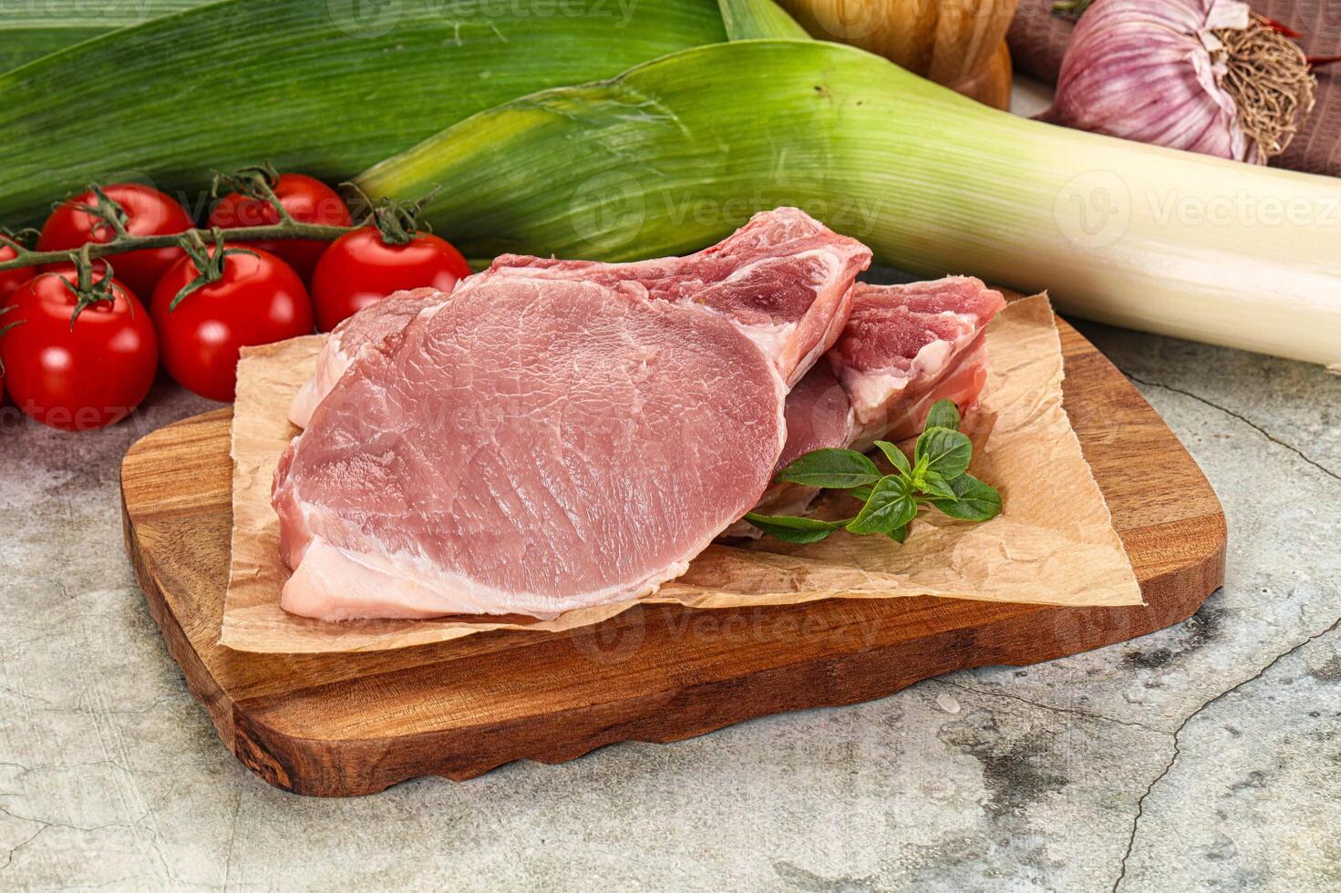 Raw pork steak loin with bone photo