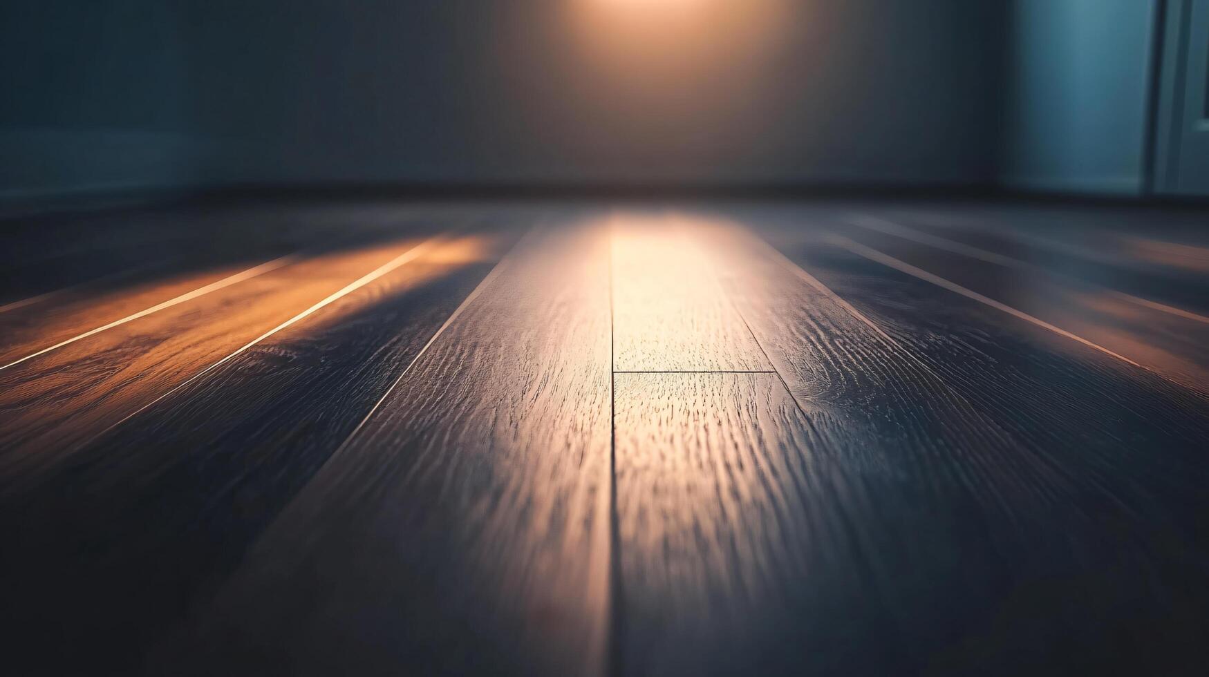 A dark wooden floor with a light shining on it photo