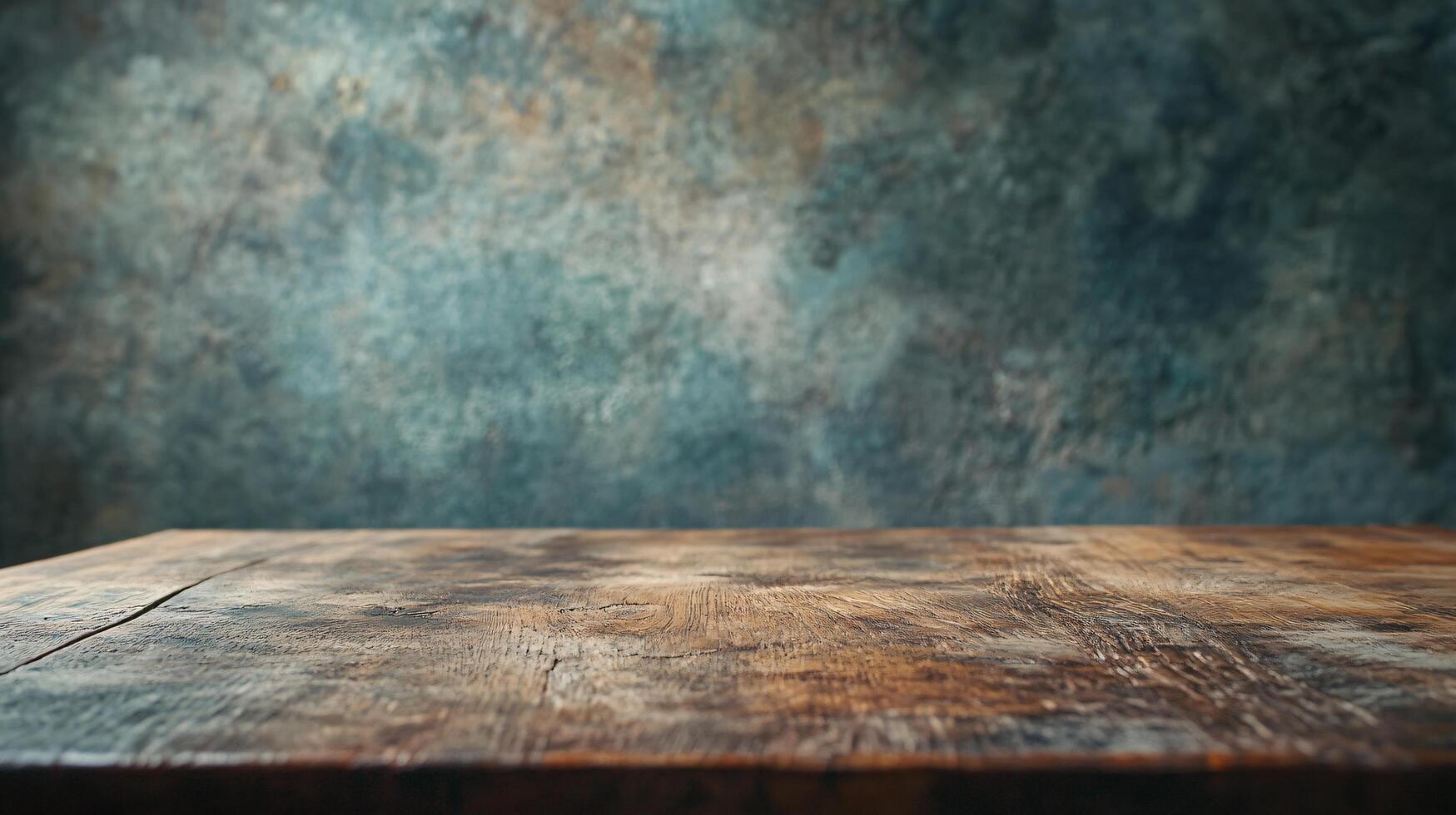A wooden table with a blue wall behind it photo