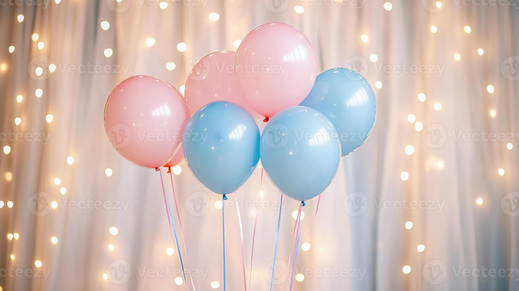 Pastel pink and blue balloons with string lights and tulle backdrop. photo