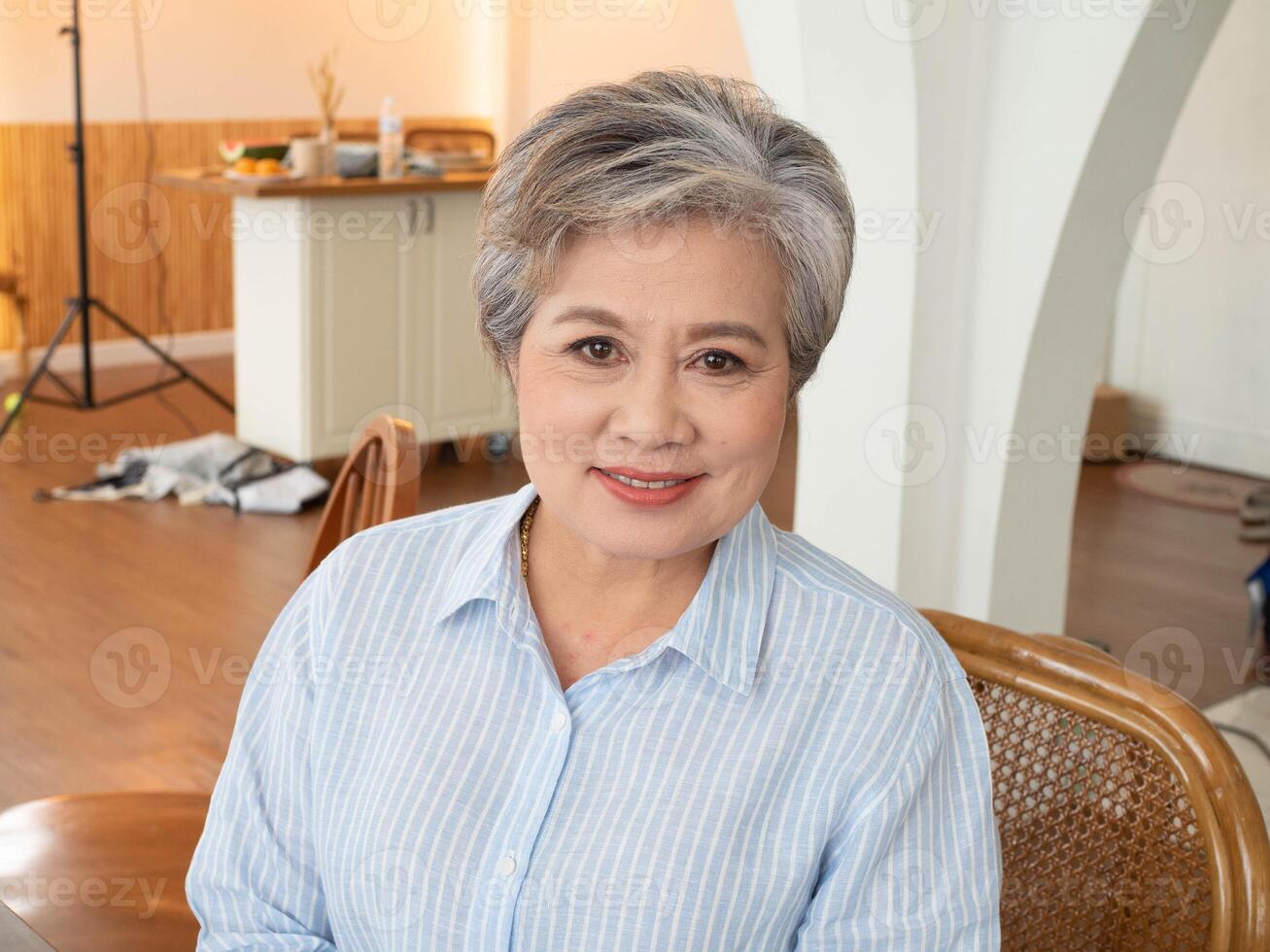 Woman day international 8 eight day date march month look at camera happy smile enjoyment funny elderly senior woman female aging beautiful mature mother portrait retirement lady home studio process photo