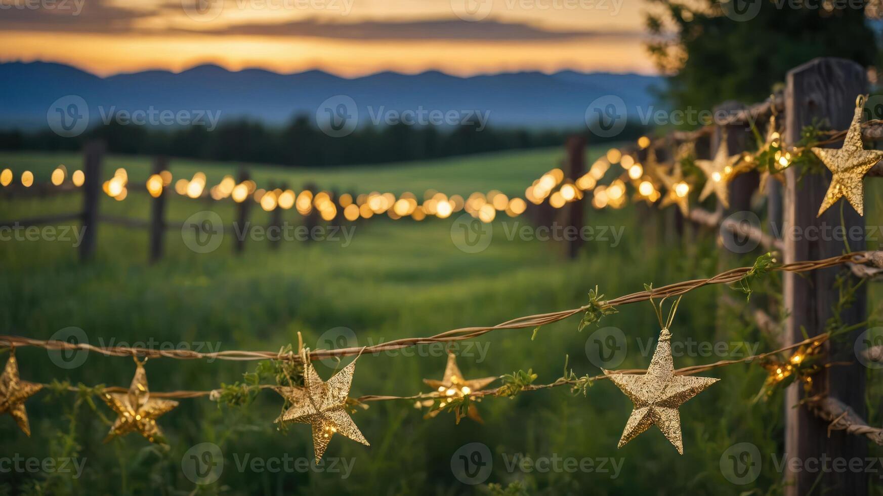 A serene landscape at sunset adorned with glowing star lights along a rustic fence. photo