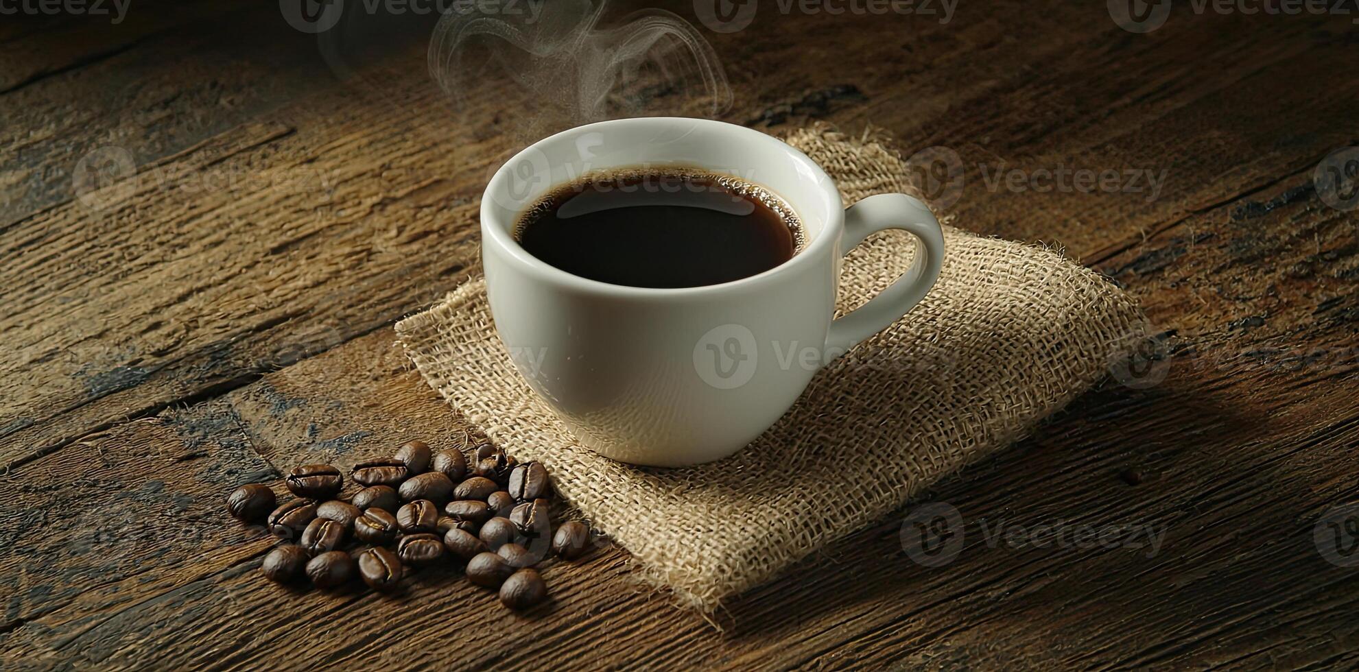 Coffee cup with steam and coffee beans on a wooden background. A cup of hot espresso or black latte, with a burlap sack on an old, rustic table photo
