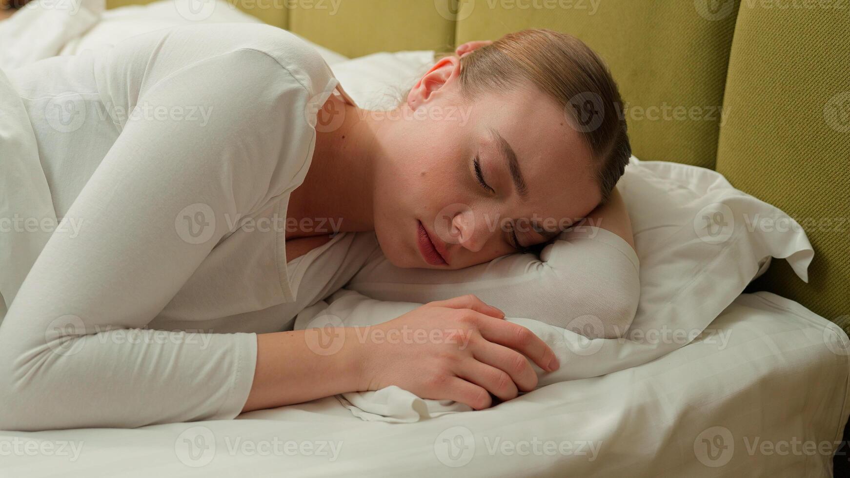 Caucasian relaxed calm peace sleeping woman female sleep napping morning in comfortable cozy bed at home hotel girl asleep lying on soft pillow white linen orthopedic mattress relaxing health care nap photo