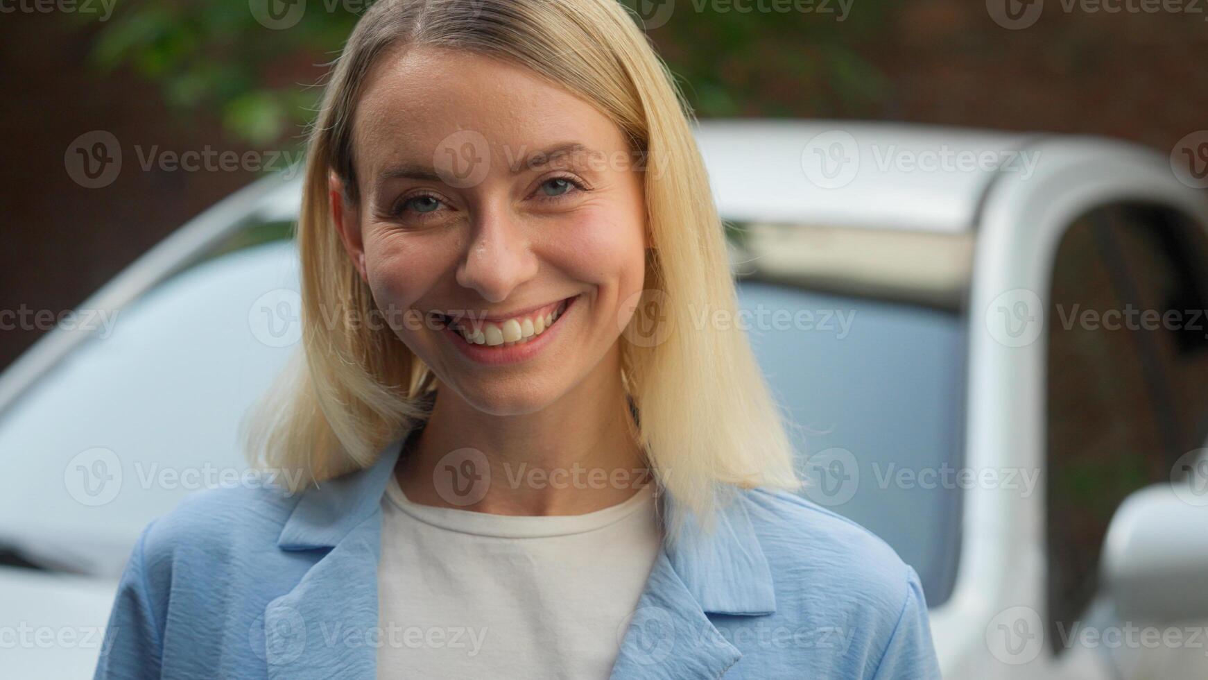 Cheerful Caucasian woman portrait happy businesswoman lady looking at camera girl client posing car ownership automobile rental service transport in city female driver auto buyer healthy dental smile photo