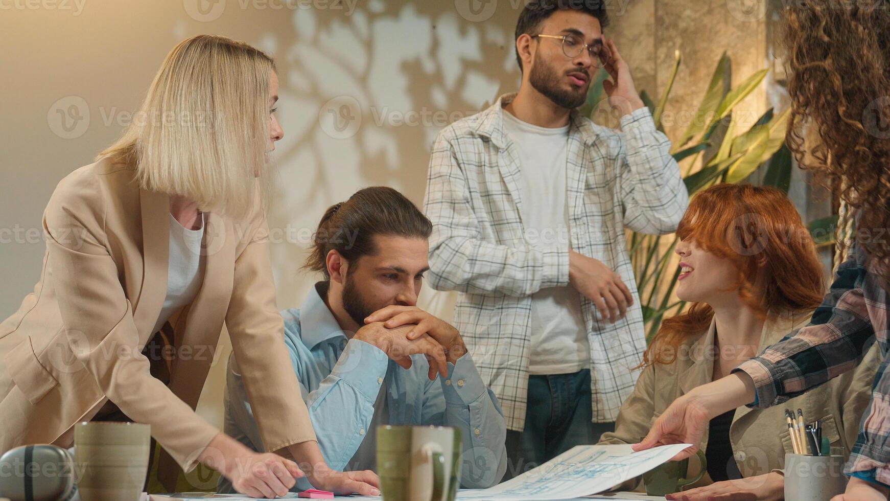 Coworking group multiracial office team men women girls guys arguing business discussion documents problem male female architects designers conflict quarrel misunderstanding shout scream fight stress photo