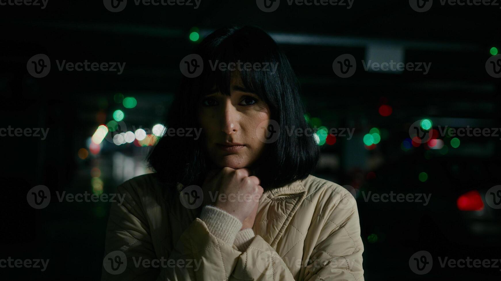 Scared worried anxious stressed afraid woman Caucasian Ukrainian girl female lady looking around standing at parking lot fear unhappy panic at dark shelter underground anxiety war bombing lost freeze photo