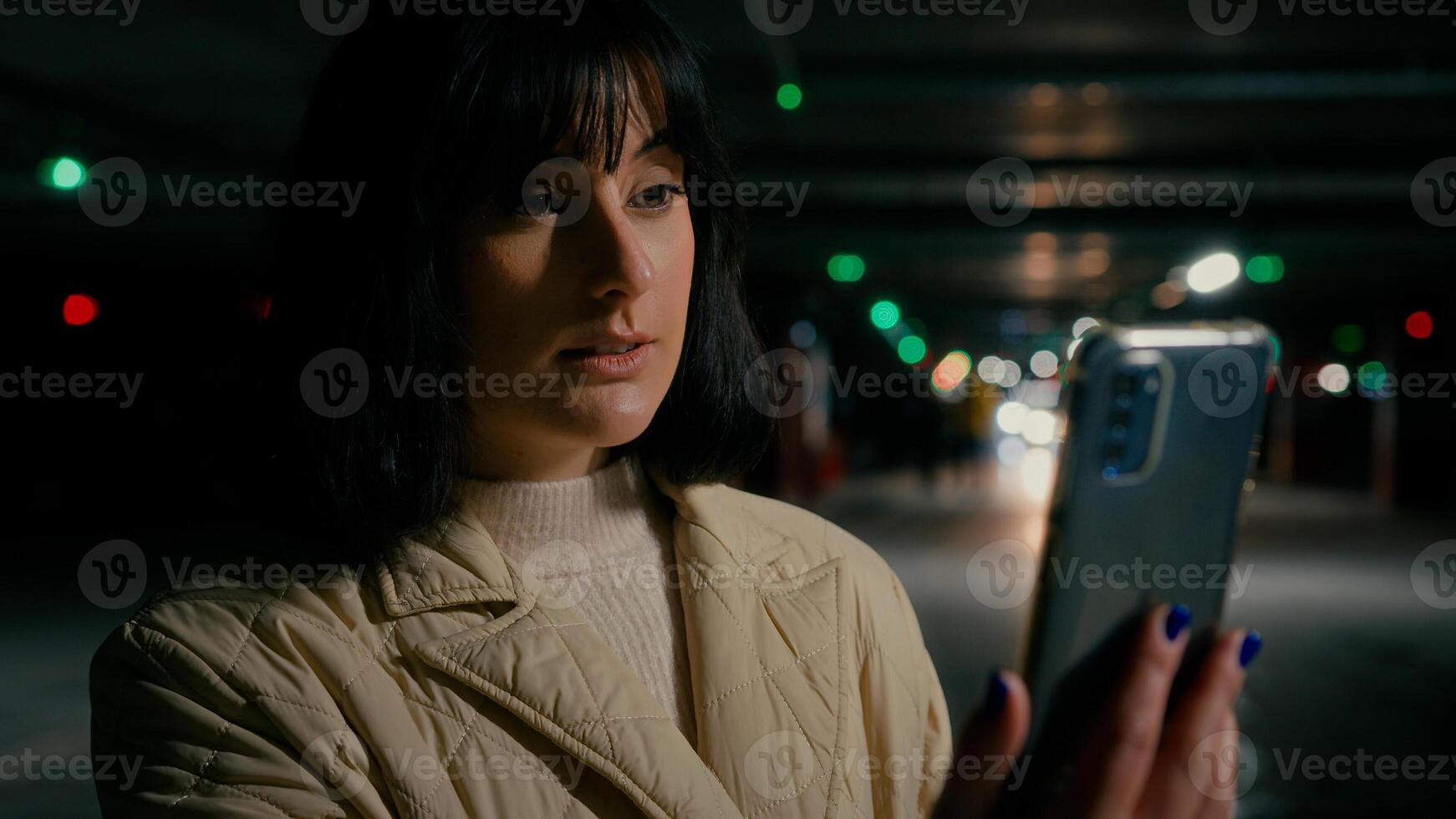 Woman at parking lot with mobile phone webcam talk has call chat distant virtual meeting with friends colleague online conference remote communicating discussion with smartphone calling smiling photo