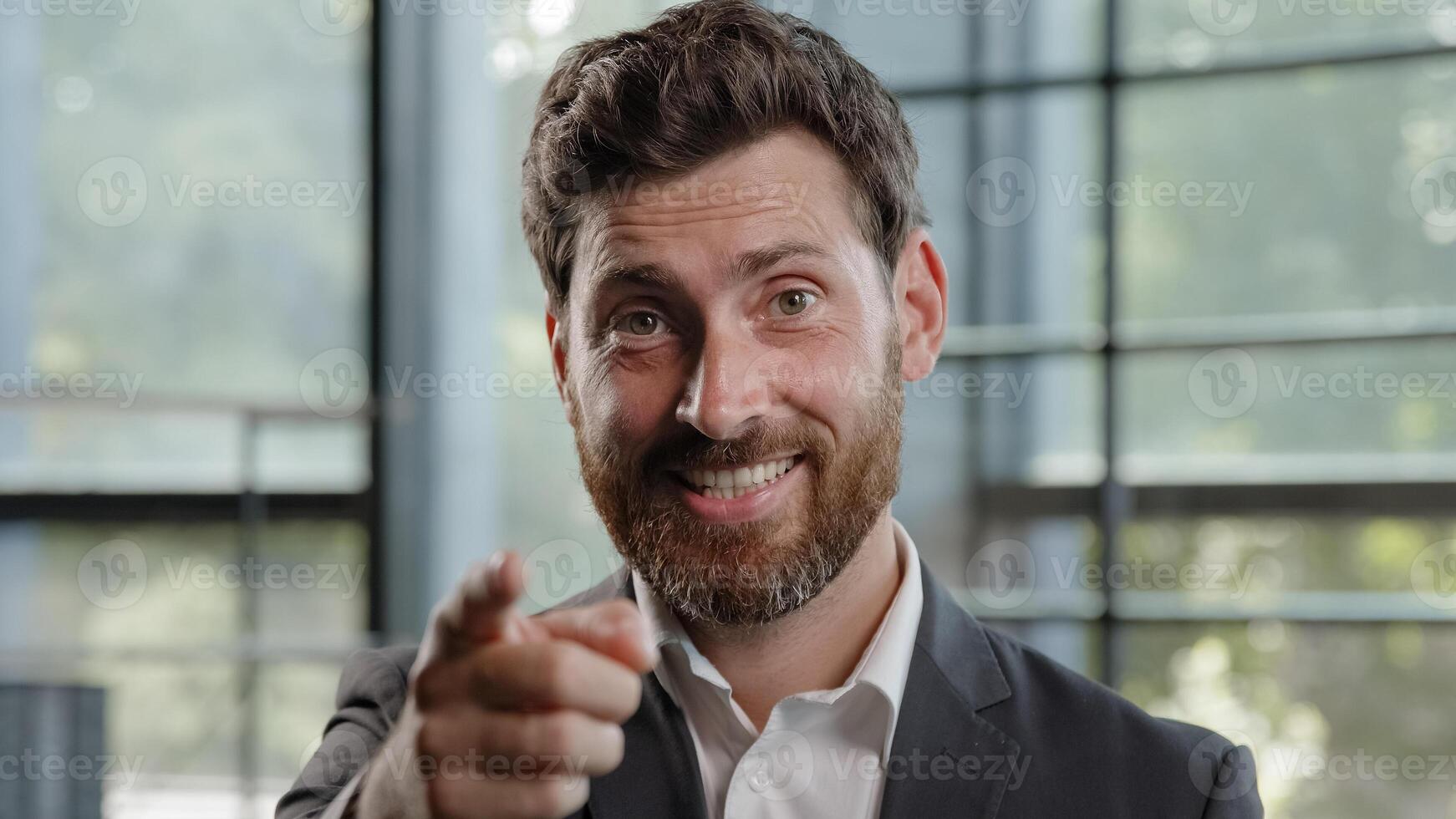Confident 40s Caucasian happy smiling leader man boss leader HR manager businessman make job offer point index finger camera hey you motivation gesture show agree approve yes support choosing select photo