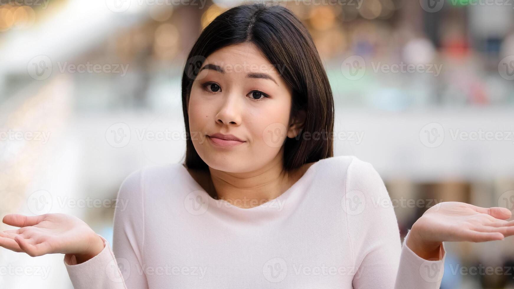 Portrait asian korean unsure embarrassed girl female model student unaware puzzled 20s woman throwing arms out to sides making gesture of doubt expresses precisely unknown uncertainty incertitude sign photo