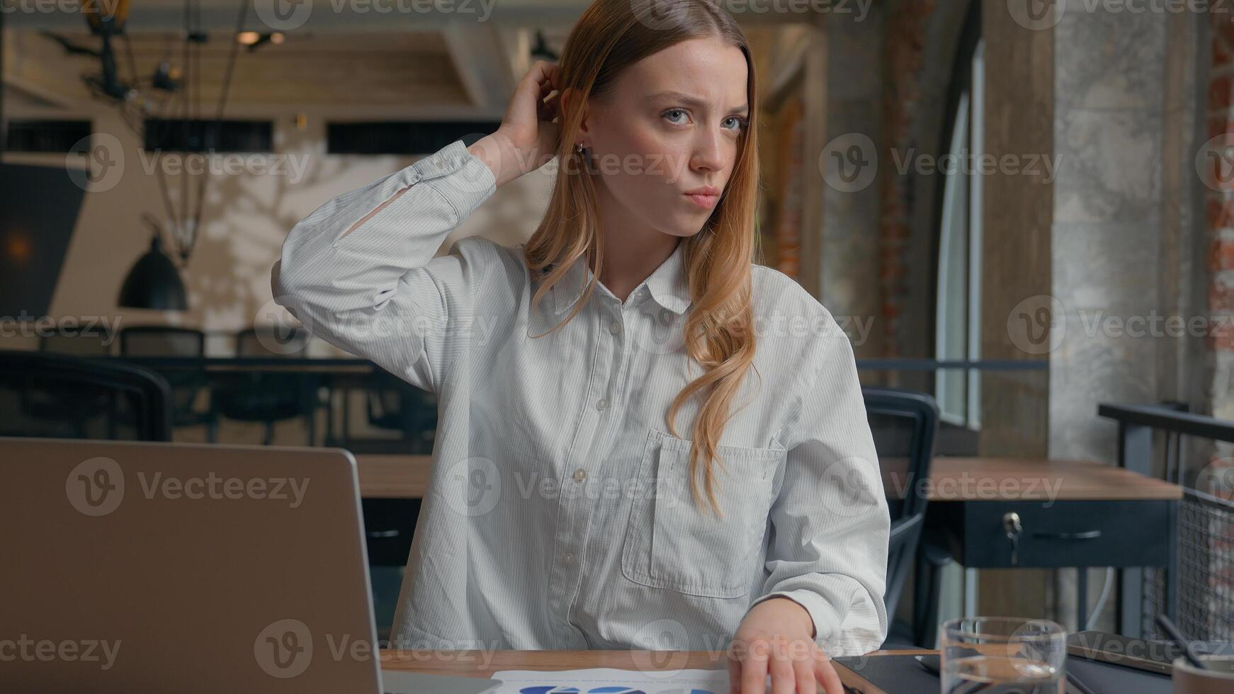 Business financial data work in office confused Caucasian girl analyze diagrams documents businesswoman female business woman scratching head thoughtful solving question problem uncertain hesitation photo