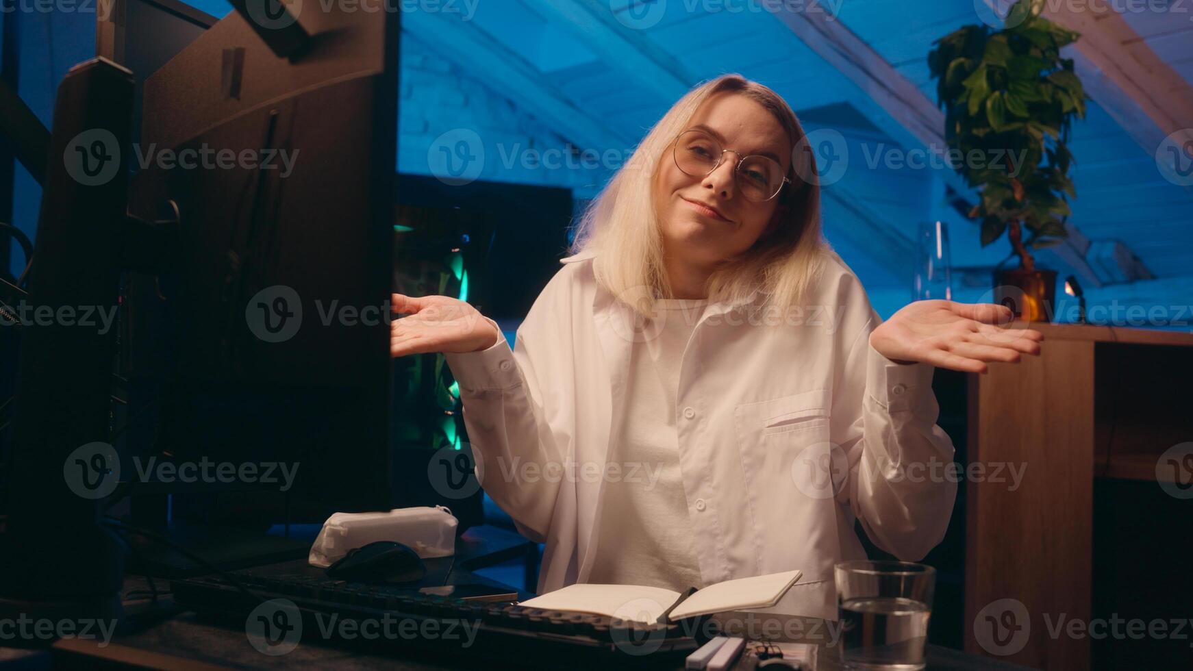 Caucasian business woman girl female crypto currency trading computer late night work overwork programmer hacker investor yawn sleep study deadline typing code insomnia sleeping tired shrug shoulders photo