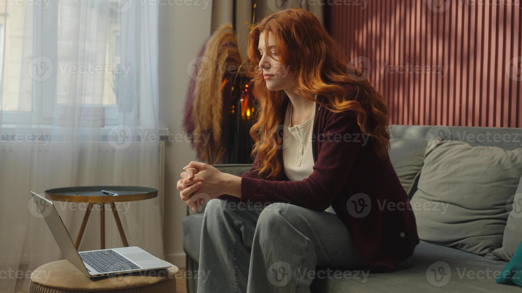 Relaxed carefree Caucasian girl woman ginger female freelancer student working remote from home relax couch sofa studying laptop online shopping food delivery drink coffee enjoy distant work smiling photo