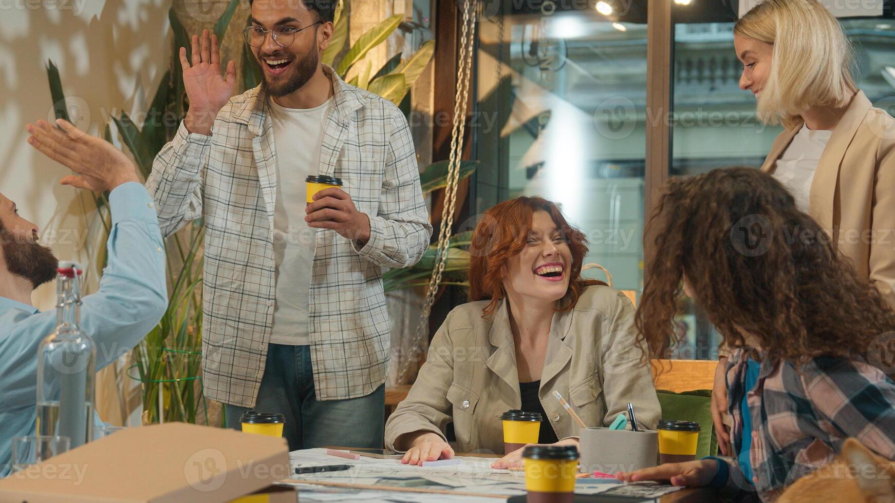 Happy company friends group men women girls guys students buddies freelance coworkers office team male female drink coffee break pet friendly coworking joyful funny celebrate teamwork high five unity photo