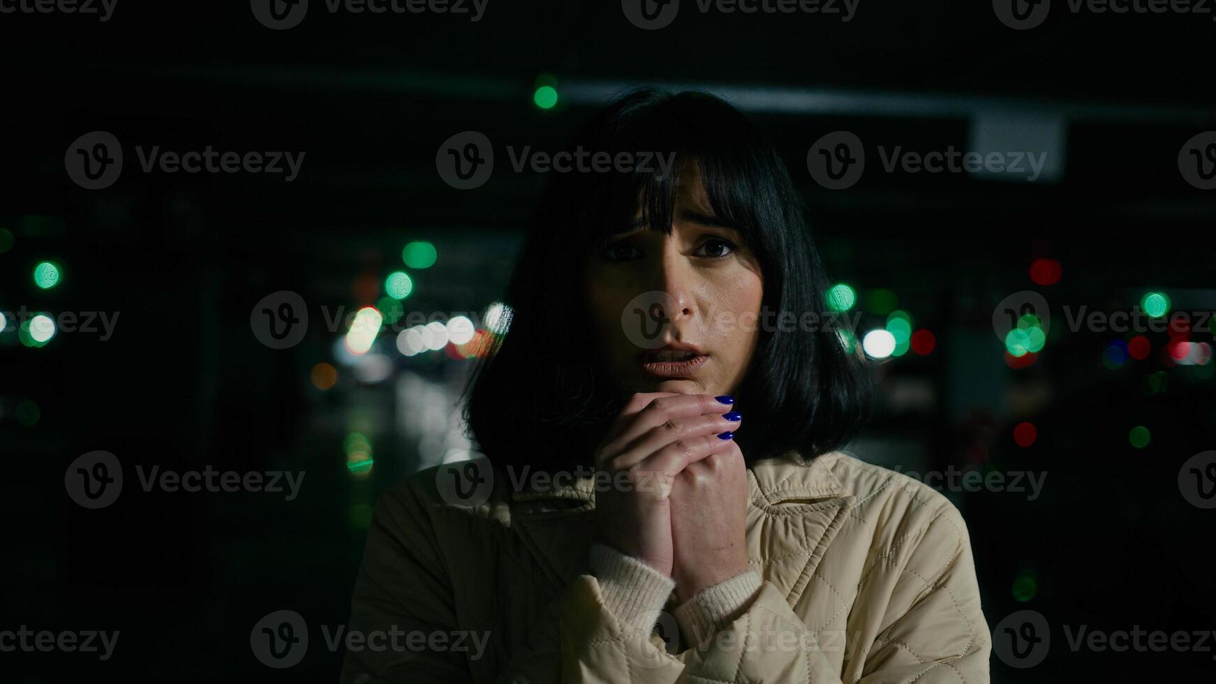 Scared worried anxious stressed woman Caucasian Ukrainian girl female lady looking around standing at parking lot fear unhappy panic at dark shelter underground anxiety war bombing lost freeze emotion photo