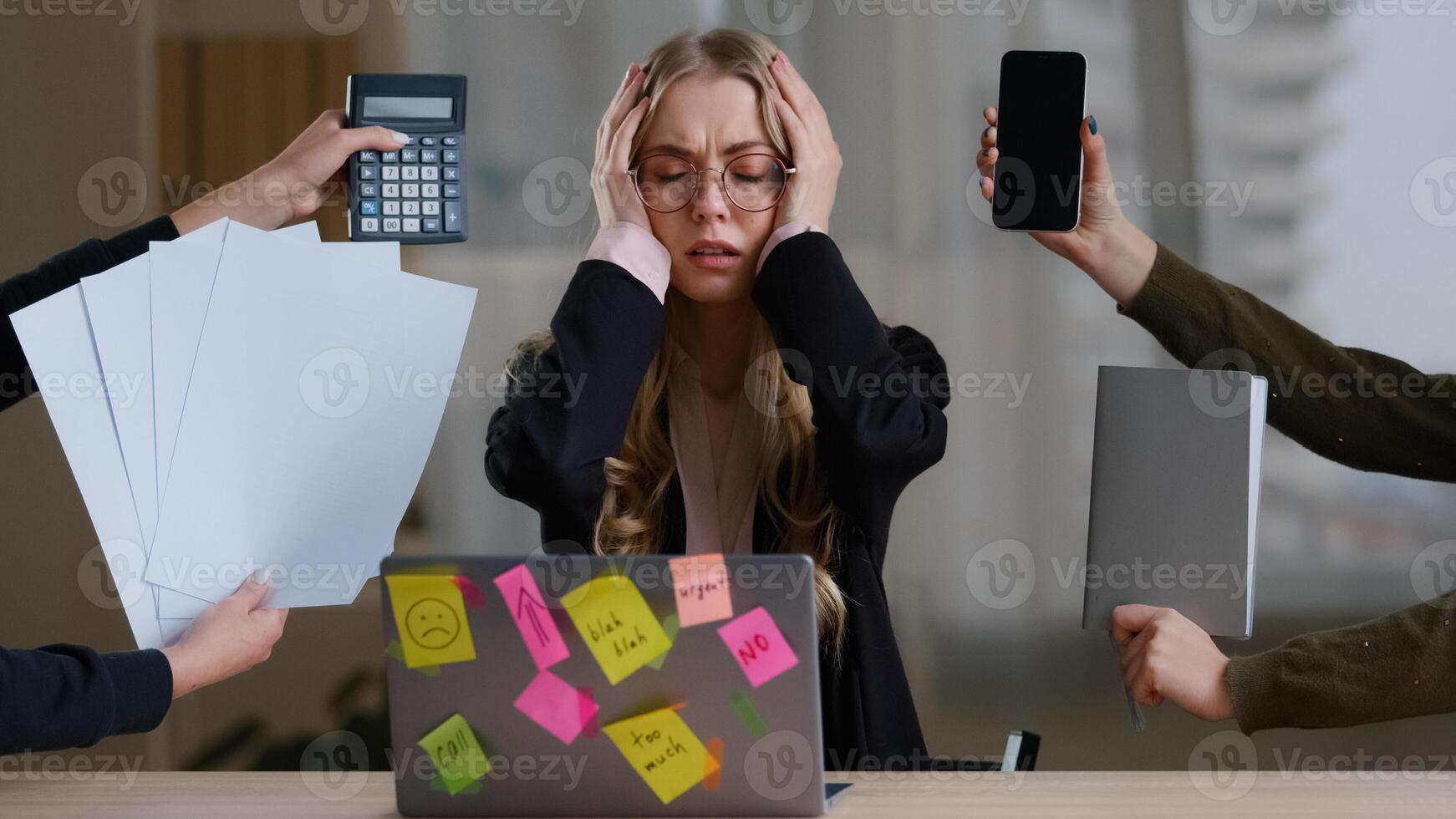 Front view overworked exhausted tired business girl woman worker manager in glasses holding head multitasking stress problem with work sitting table with laptop around calculator notebook papers phone photo