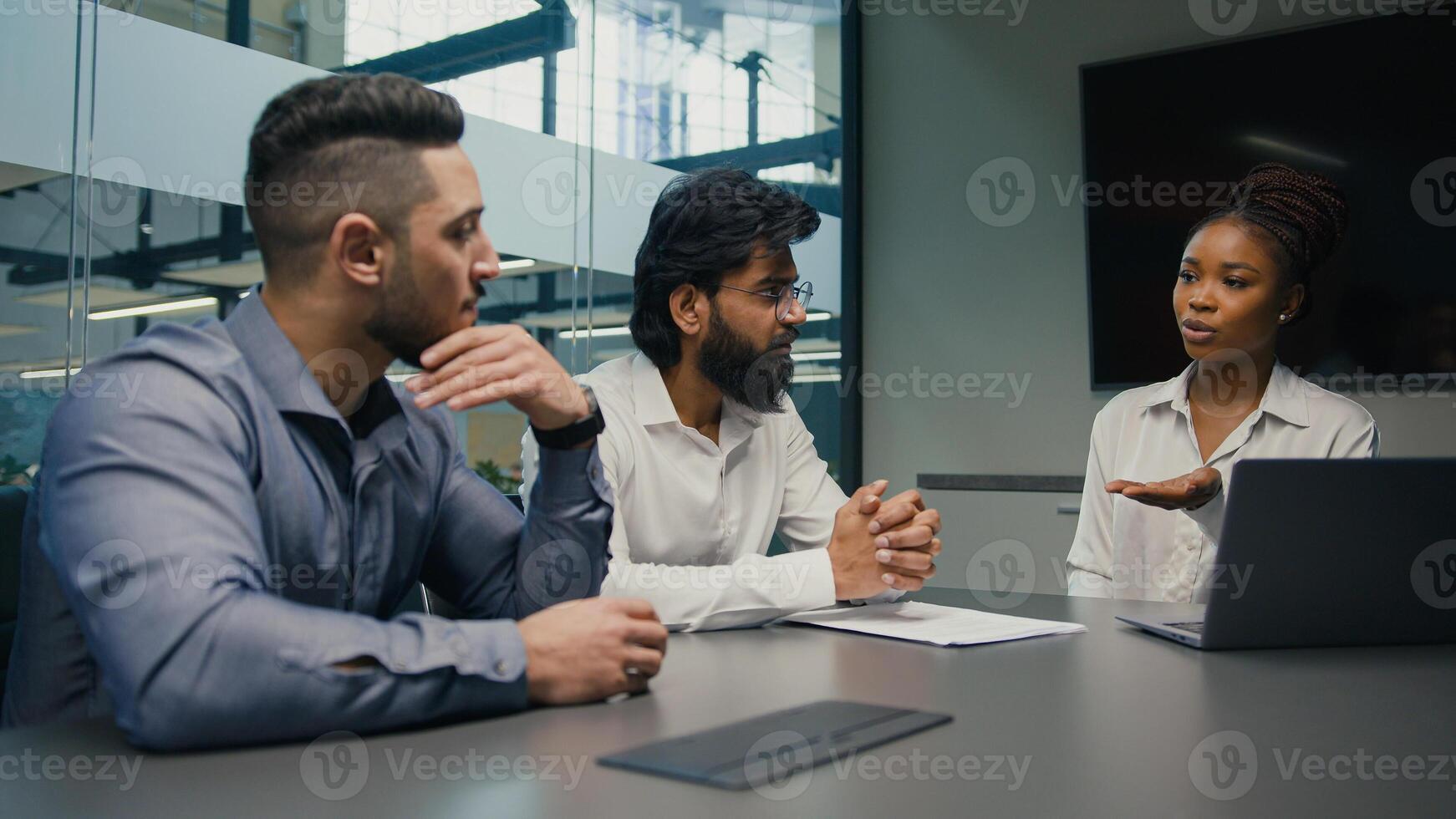African American female businesswoman company CEO corporate mentor coach with laptop computer discuss startup service project software with multiethnic business team diverse men brainstorm in office photo