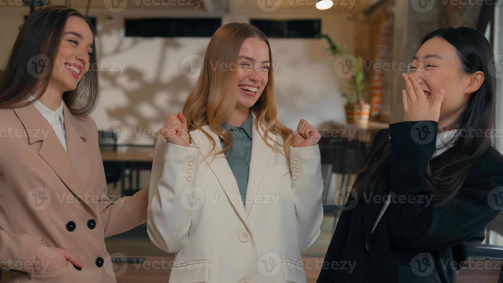 Happy smiling laughing joyful positive friendly business women people colleagues females multiracial multiethnic girls businesswomen diversity Caucasian Asian Korean friends talking in office laugh photo