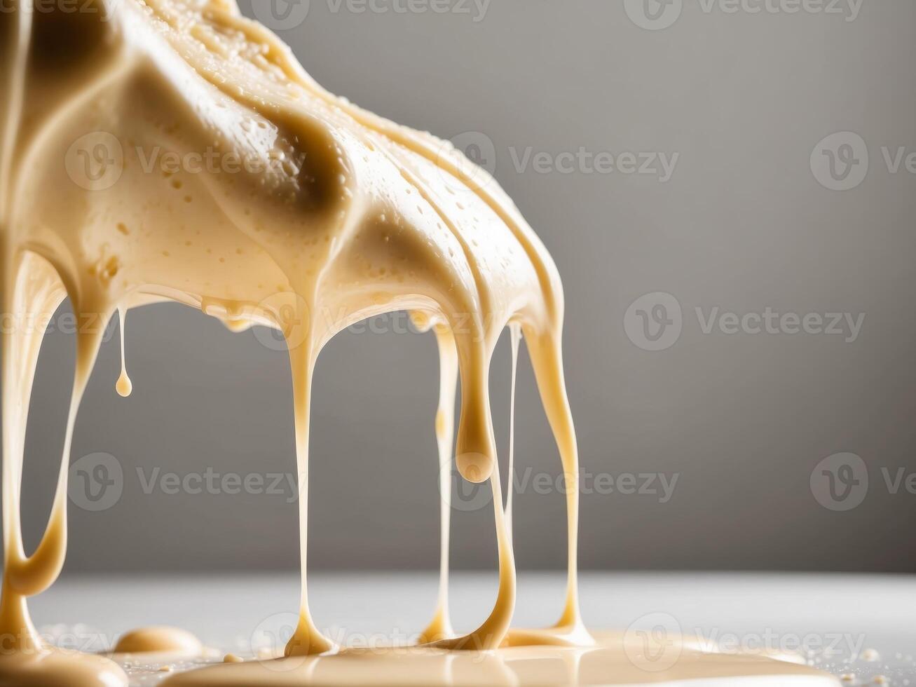 Bubbling and Dripping Cheese Textures in Motion photo