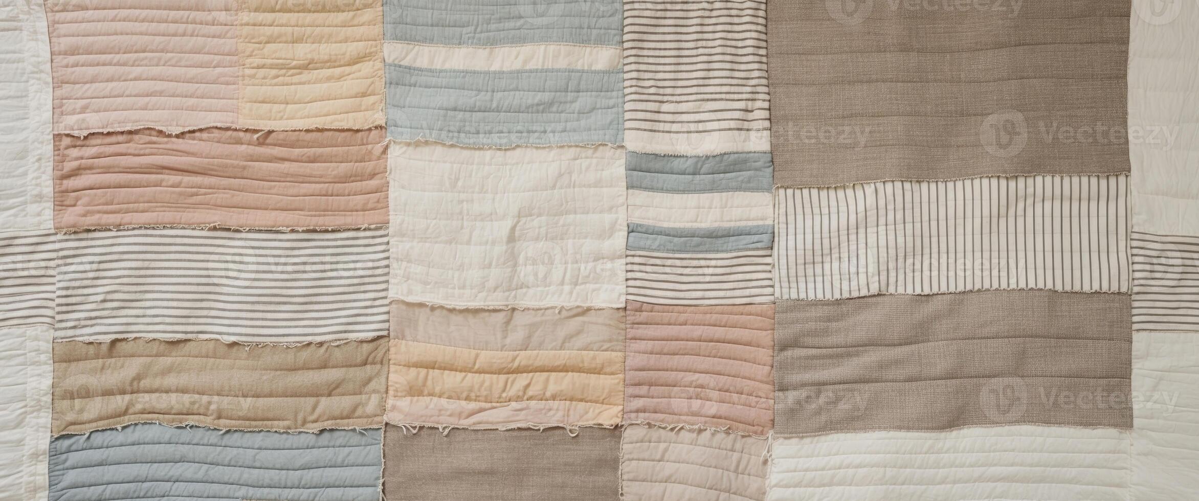 Faded colors and rustic fabric create cozy patchwork quilt texture photo