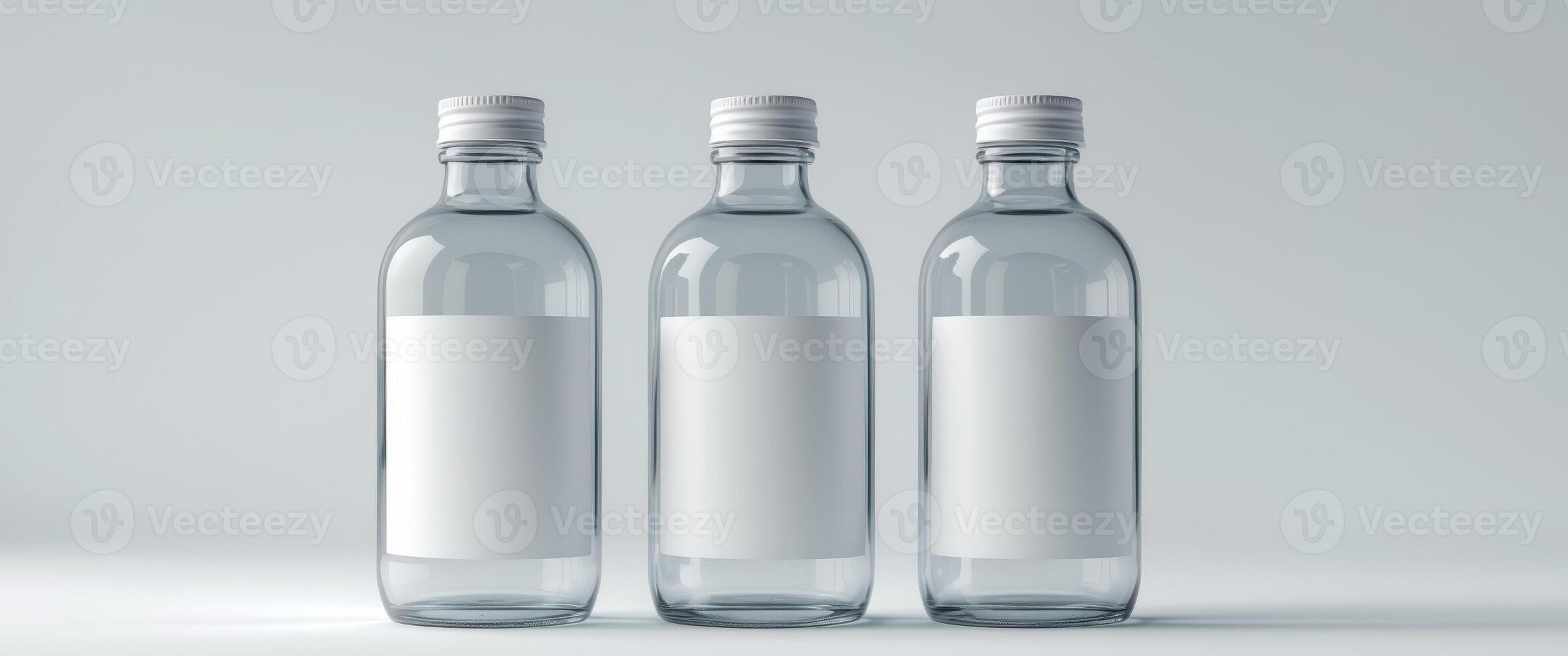 Display mockup featuring three bottles with blank labels on a clean background for creative design purposes photo