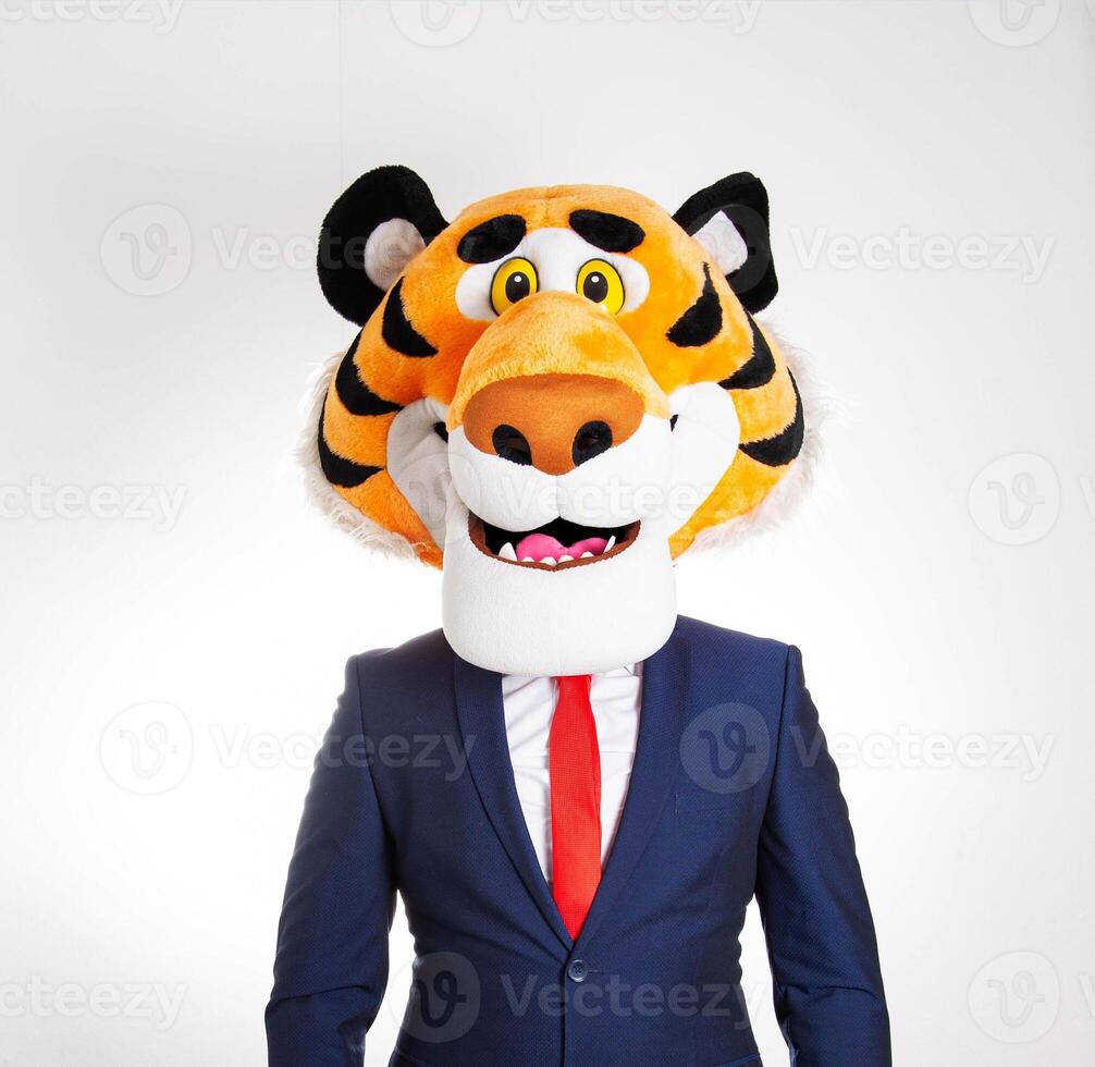 A businessman in a funny tiger mask looks at the camera on a white background, close-up. Angry boss, stress resistance at work photo