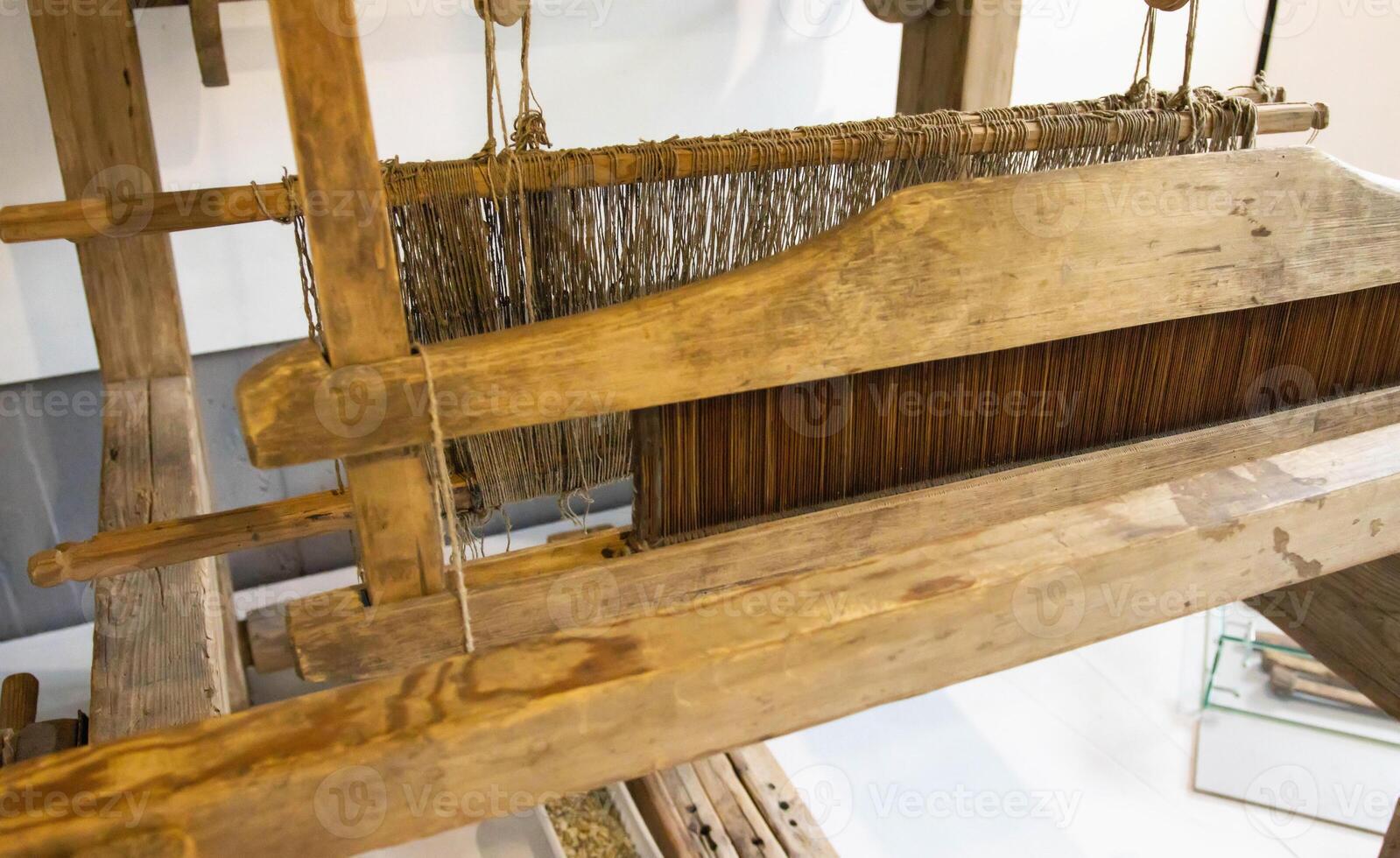 Old loom. Device for the manufacture of textile products, close-up, traditional photo