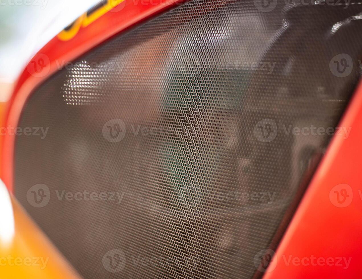 Protective net engine compartment in the car, an element of tuning. Background, copy space, mesh photo