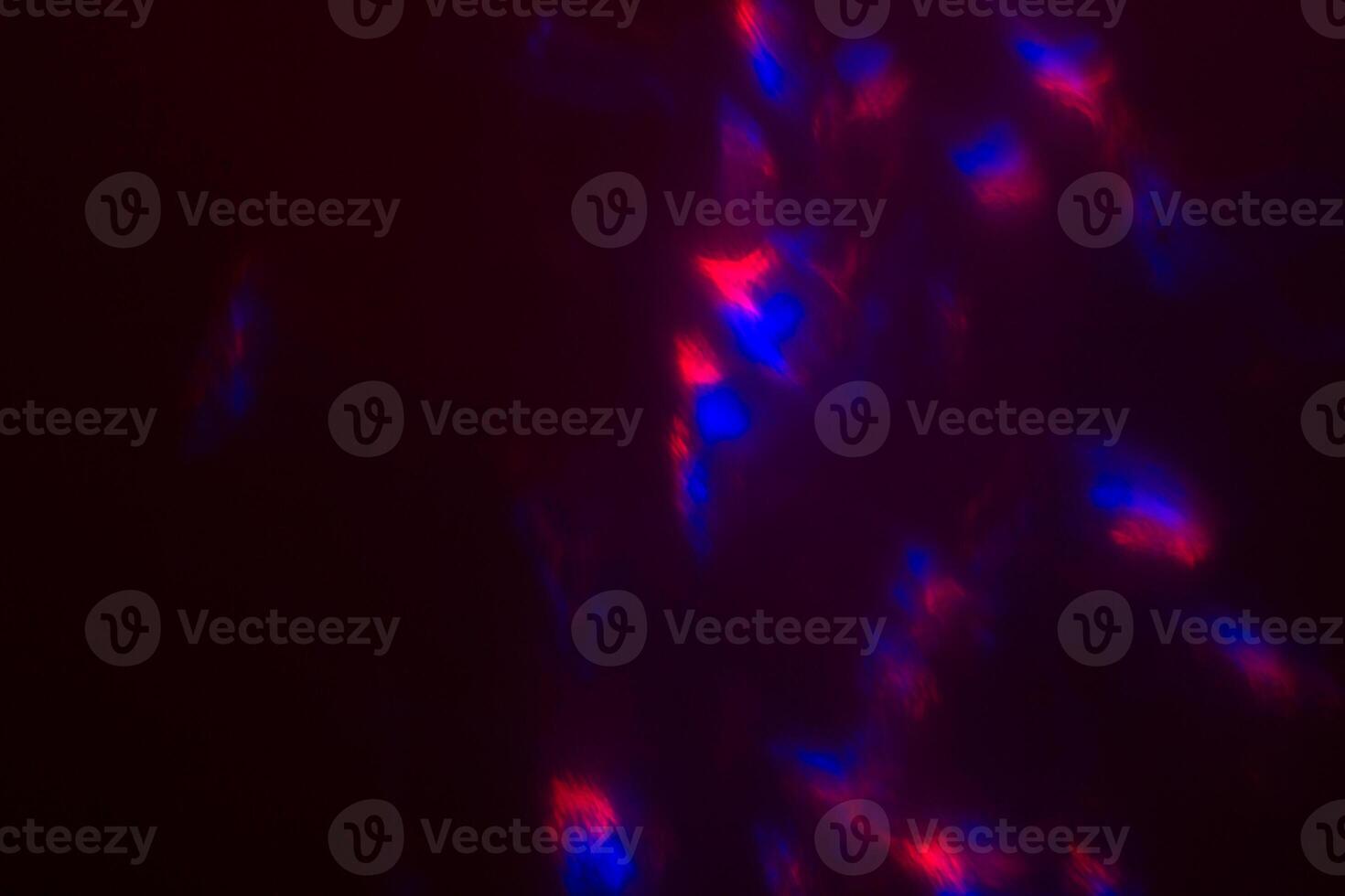 Blurred lens flare. Defocused colorful lights. Shiny glowing spots, abstract background and texture photo