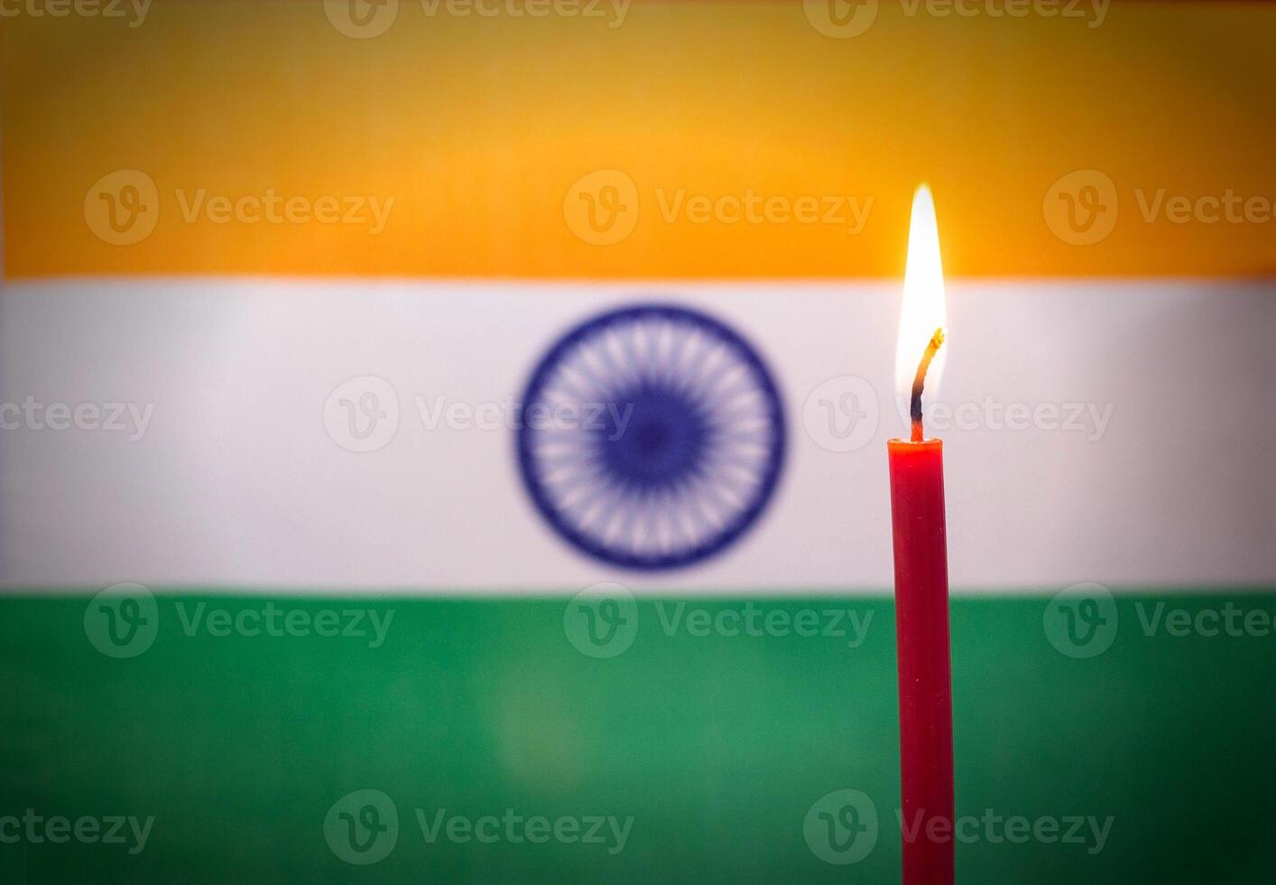Burning candle on the background of the flag of India. The concept of mourning and sorrow in the country, terrorism photo