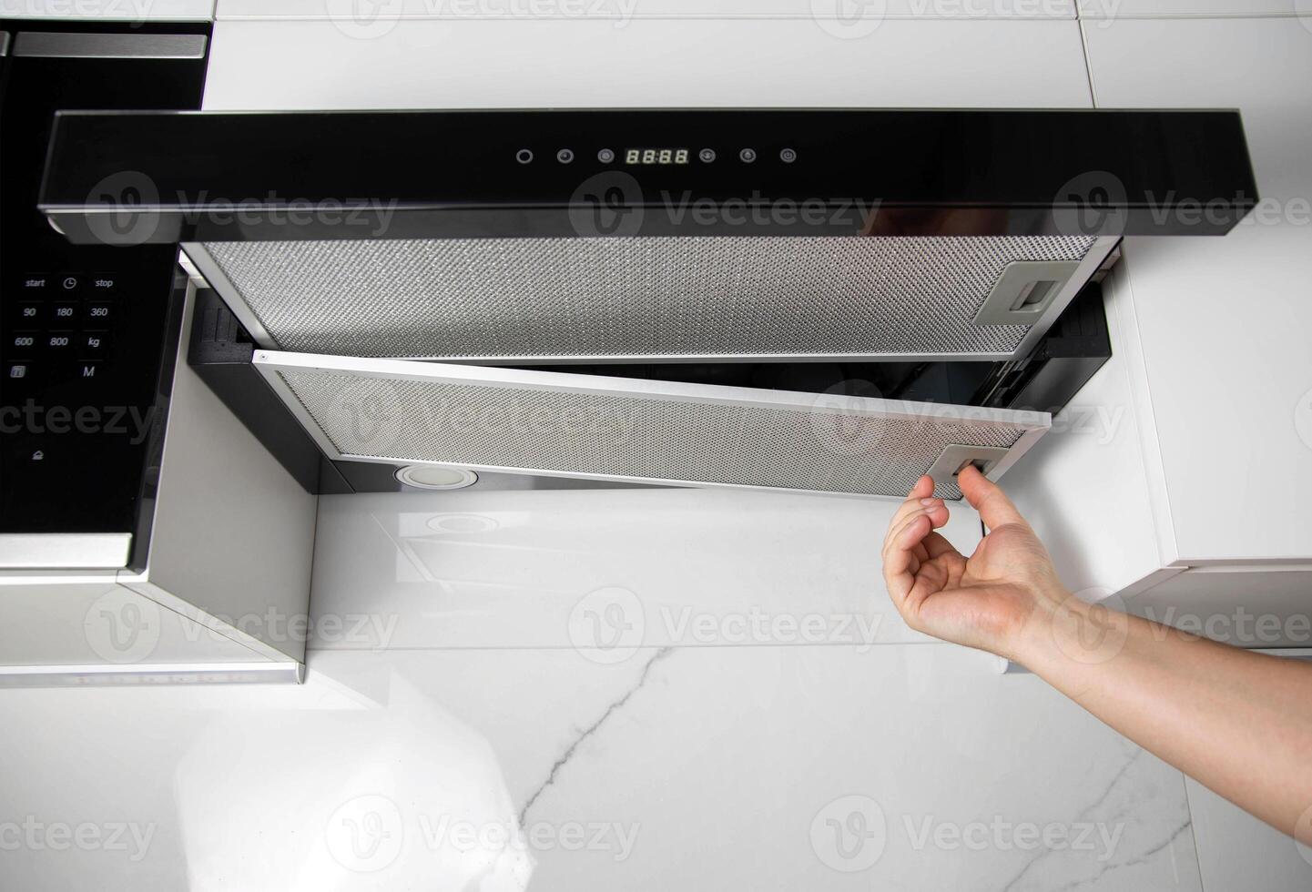 replacement of the grease filter in the kitchen hood. Copy space for text photo