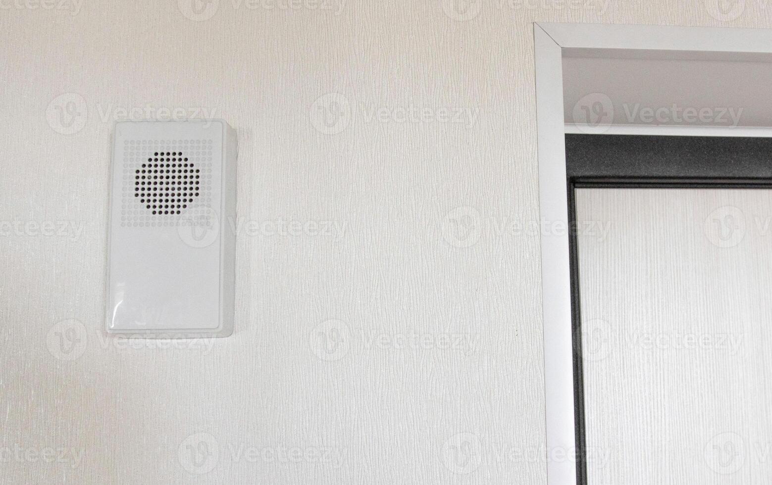 A modern electronic doorbell is designed to give an audible signal in residential premises. Copy space for text photo