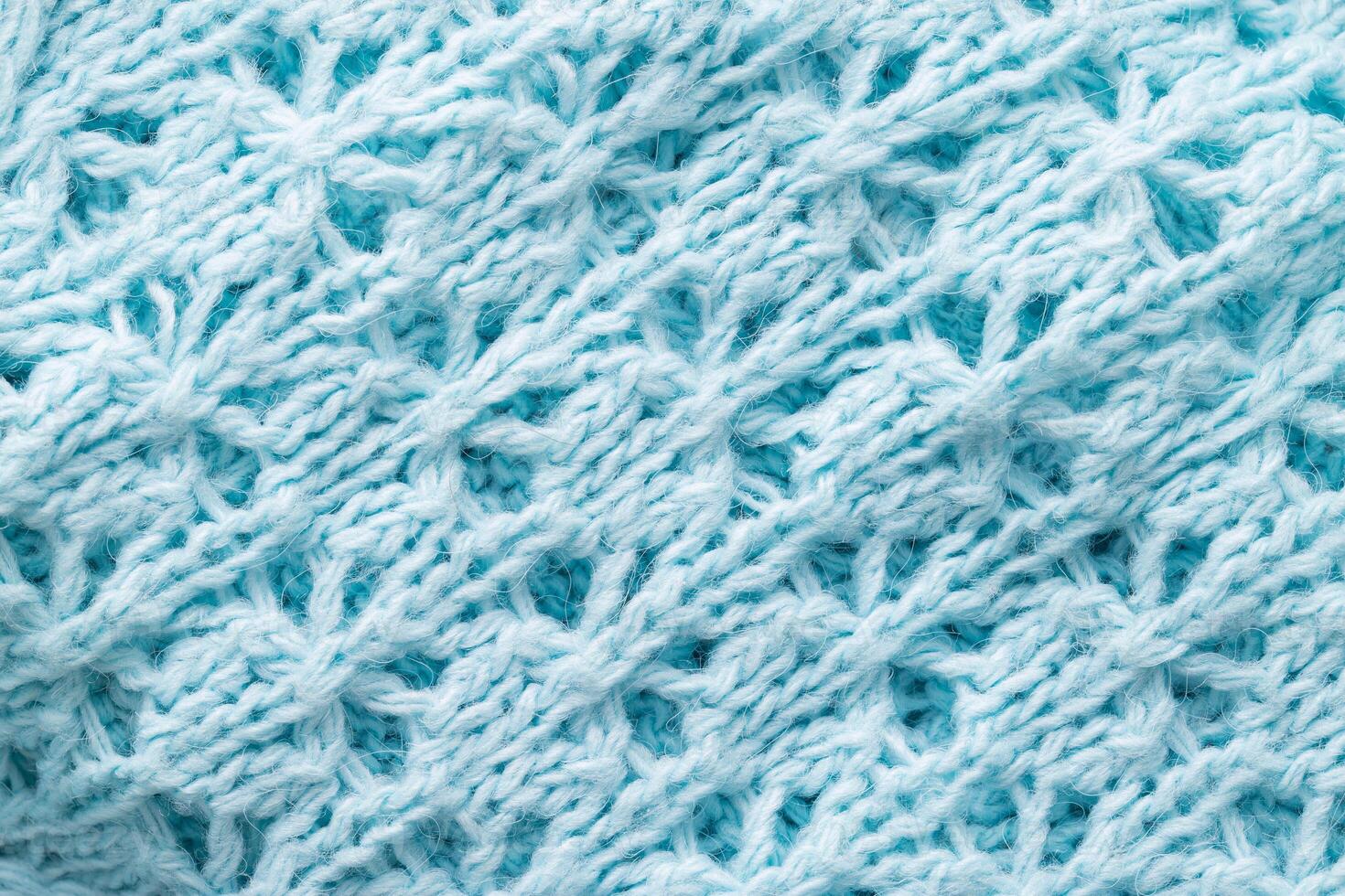 knitted winter blue sweater, handmade. Macro, fabric photo