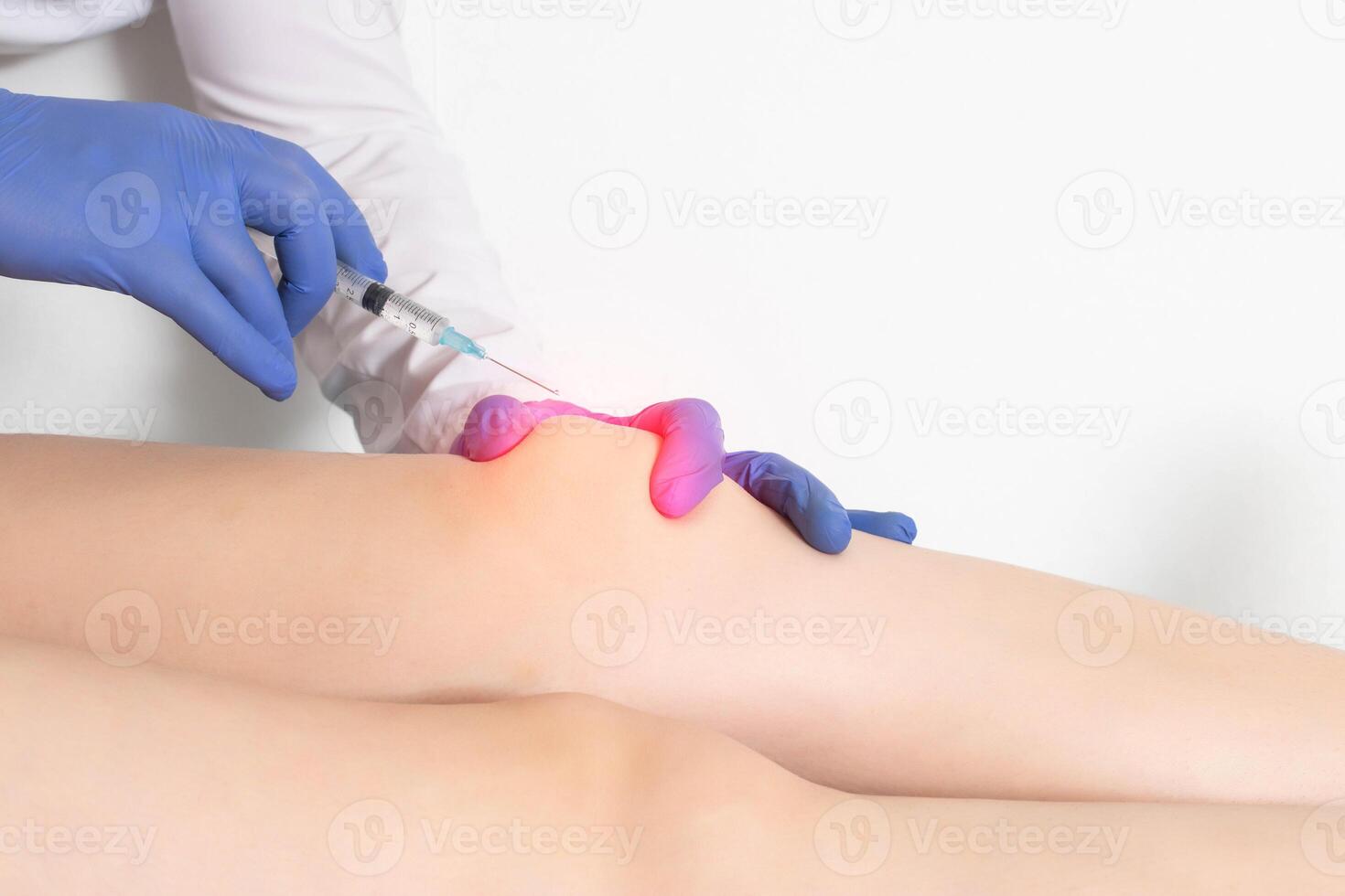 The doctor makes an injection of plasma therapy into the knee joint of the patient after surgery and prosthetics to heal and restore cartilage tissue, copy space for text photo