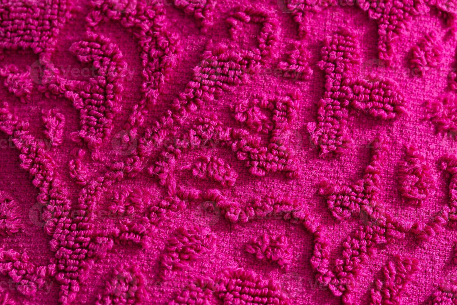 texture of burgundy terry towel with a pattern, close-up. Background photo